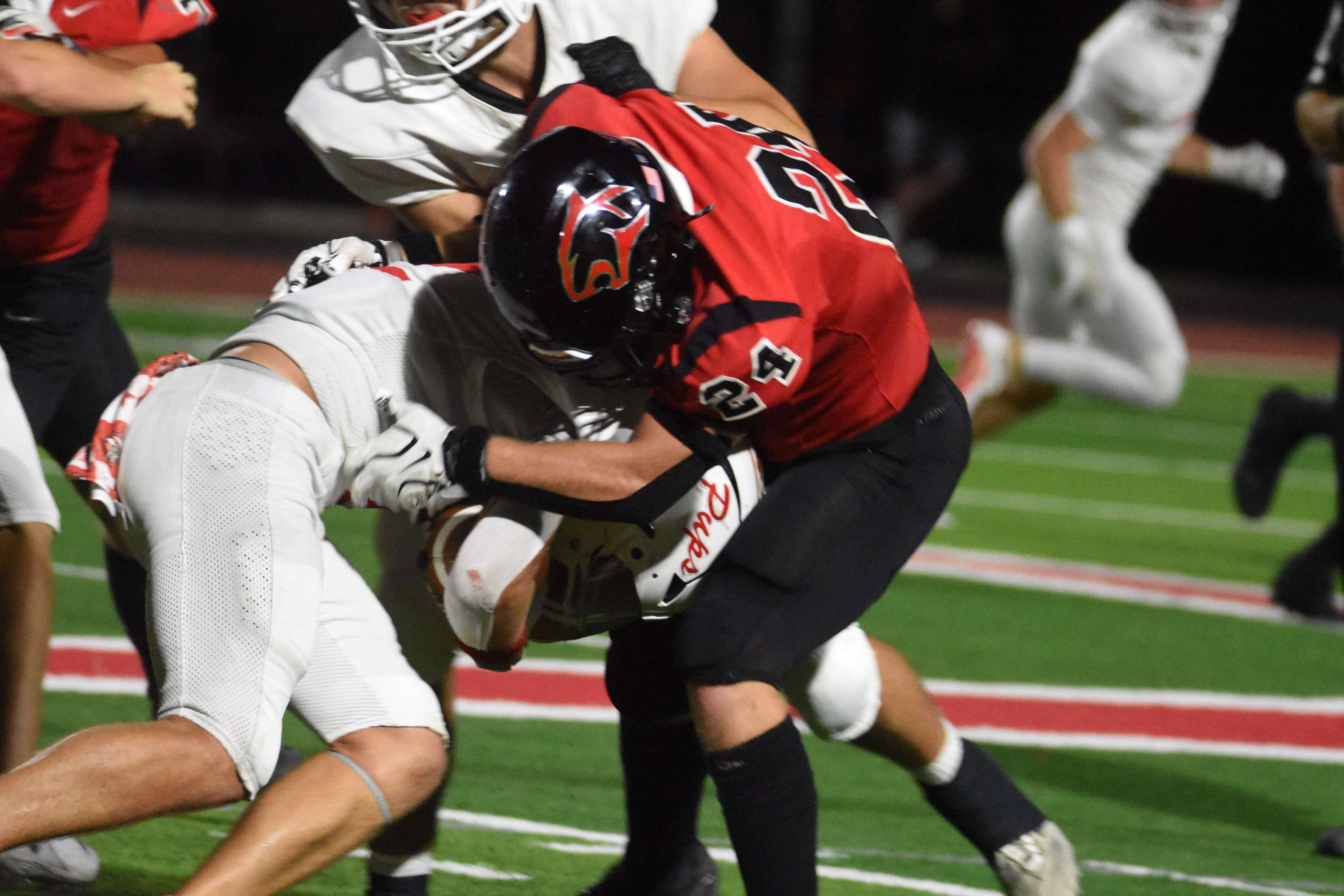 Panther senior Jaxon Wondra brings down McPherson senior Dane Becker during Friday's 21-3 win over the Bulllpups. Wondra opened the second half with a 45-yard interception return for a score.