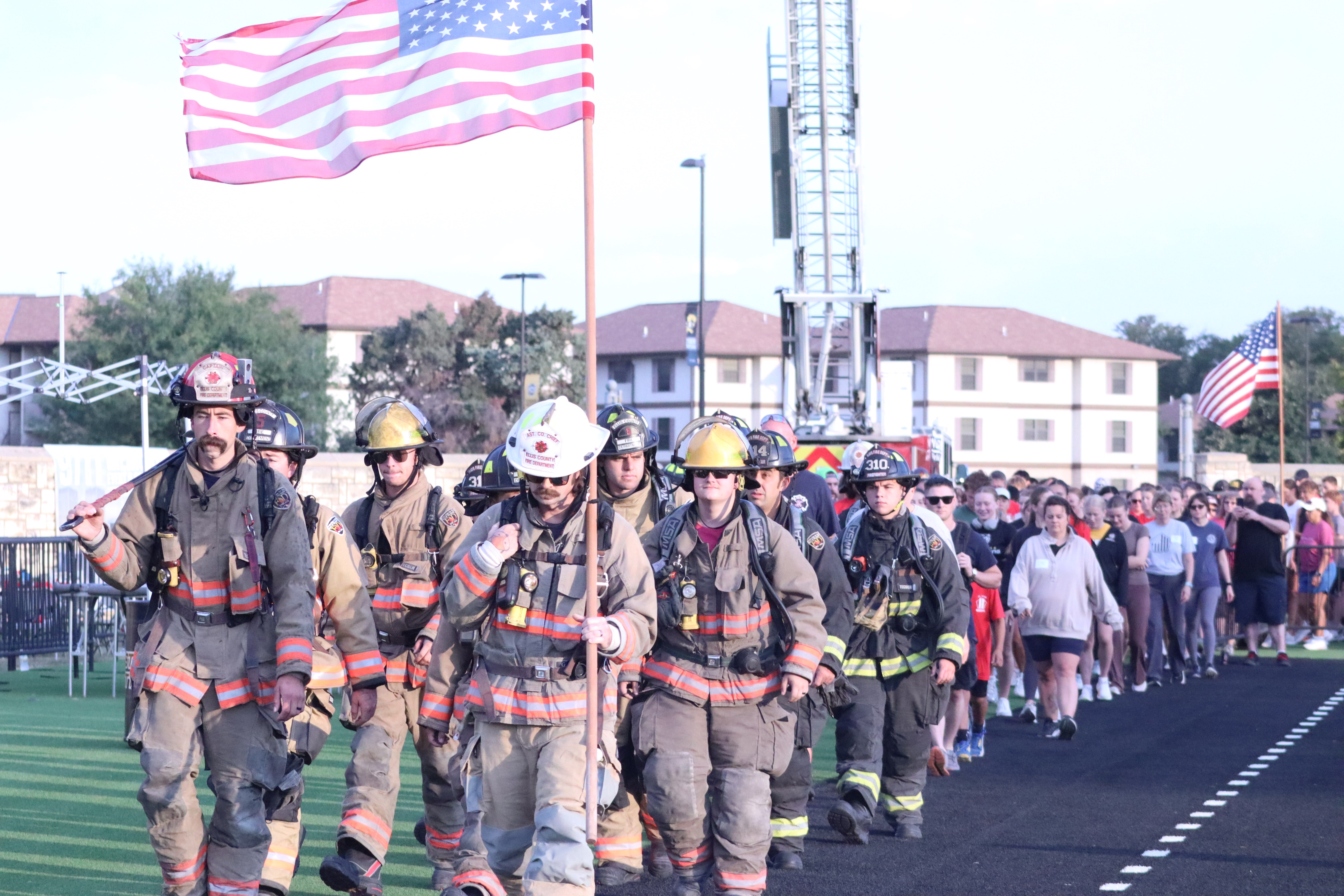 Firefighters lead participants around Lewis Field during the annual 9/11 Memorial Stair Climb at Fort Hays State University. Photos by Alin Hett/Hays Post<br>