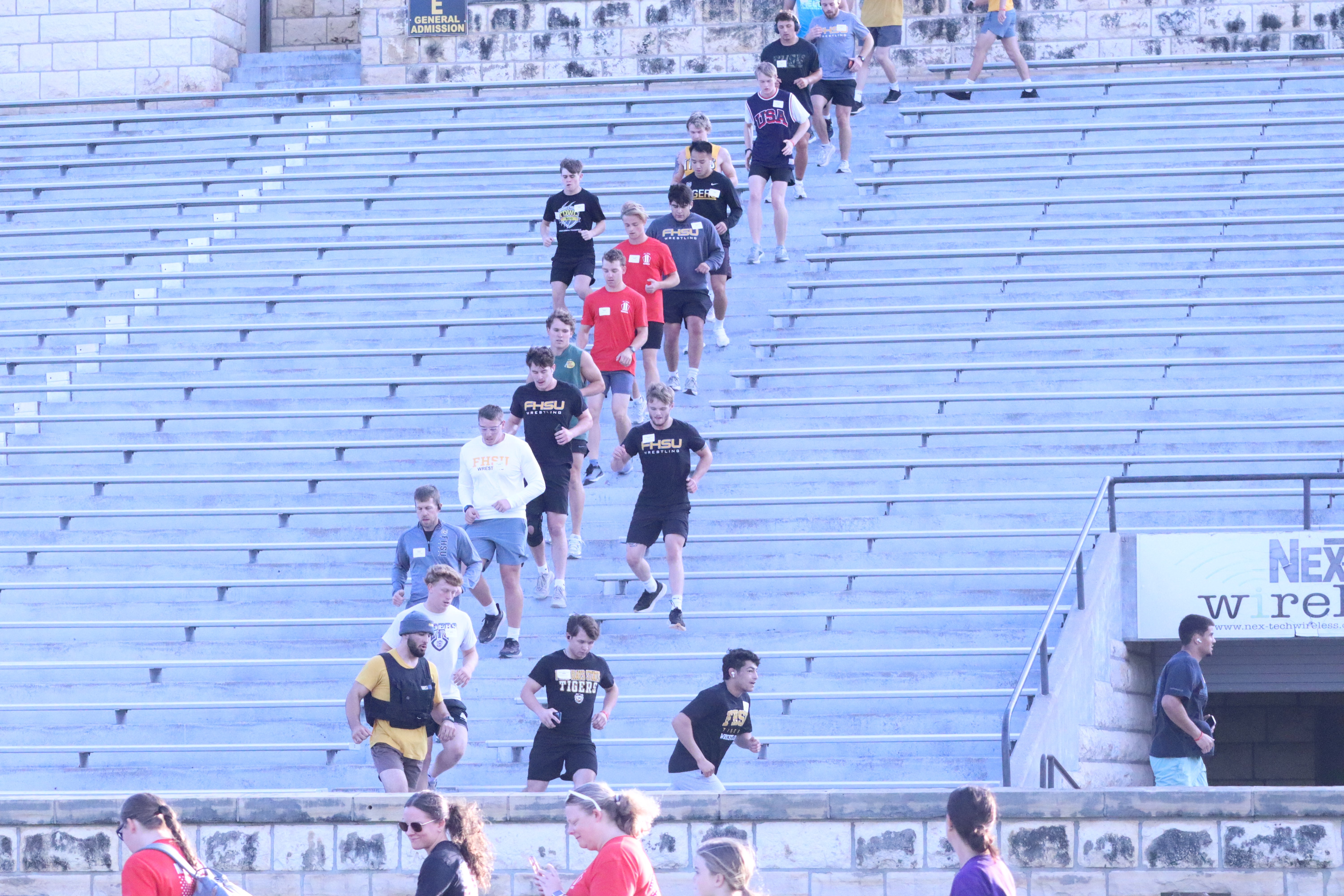 Participants run up and down the stairs at Lewis Field Stadium during the annual 9/11 Memorial Stair Climb.<br>