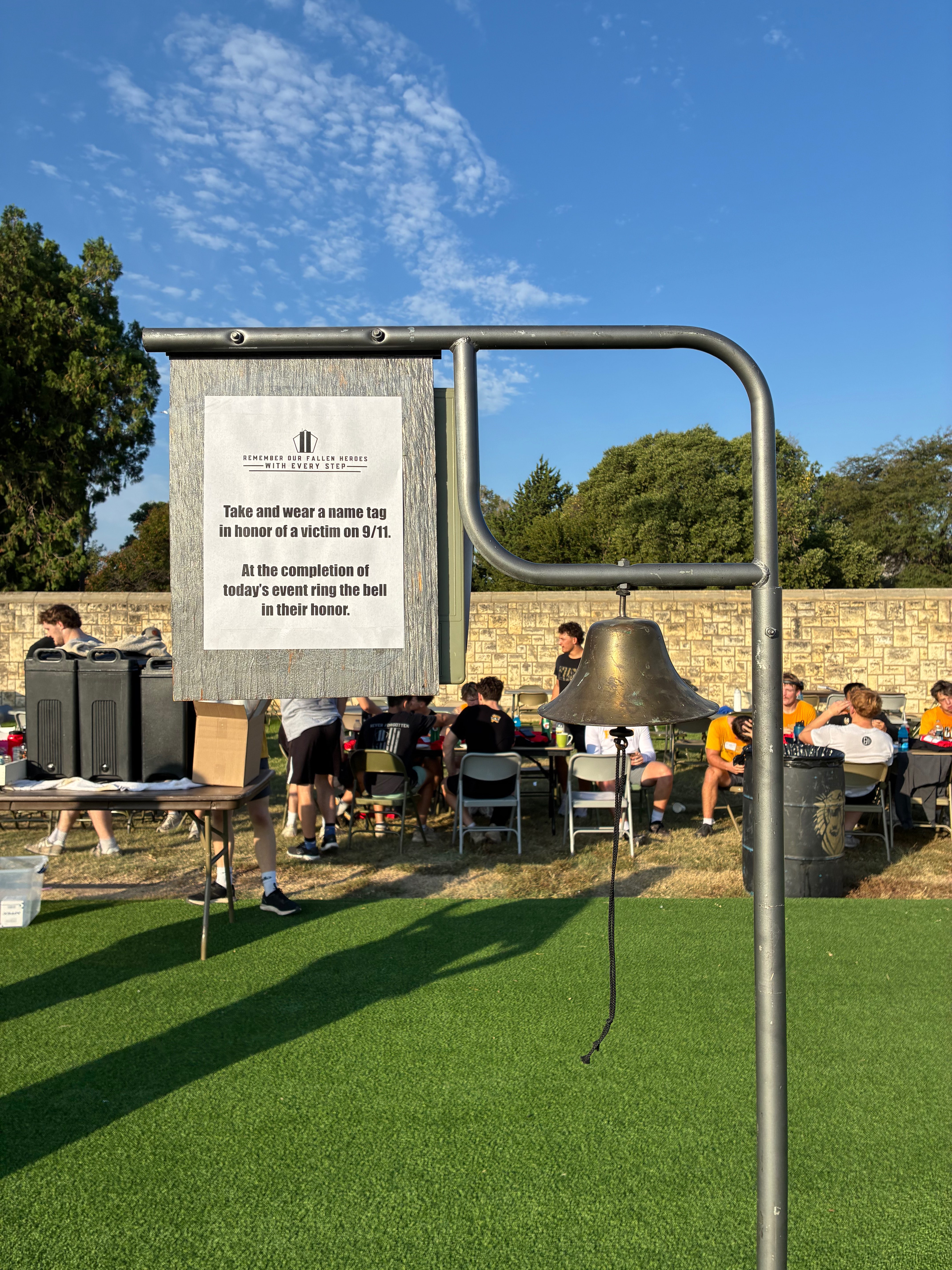 A bell waits for participants to ring after completing the 9/11 Memorial Stair Climb at Lewis Field Stadium. Participants were encouraged to wear the name of a person who died on Sept. 11, 2001, and ring the bell in their honor after finishing the climb.<br>