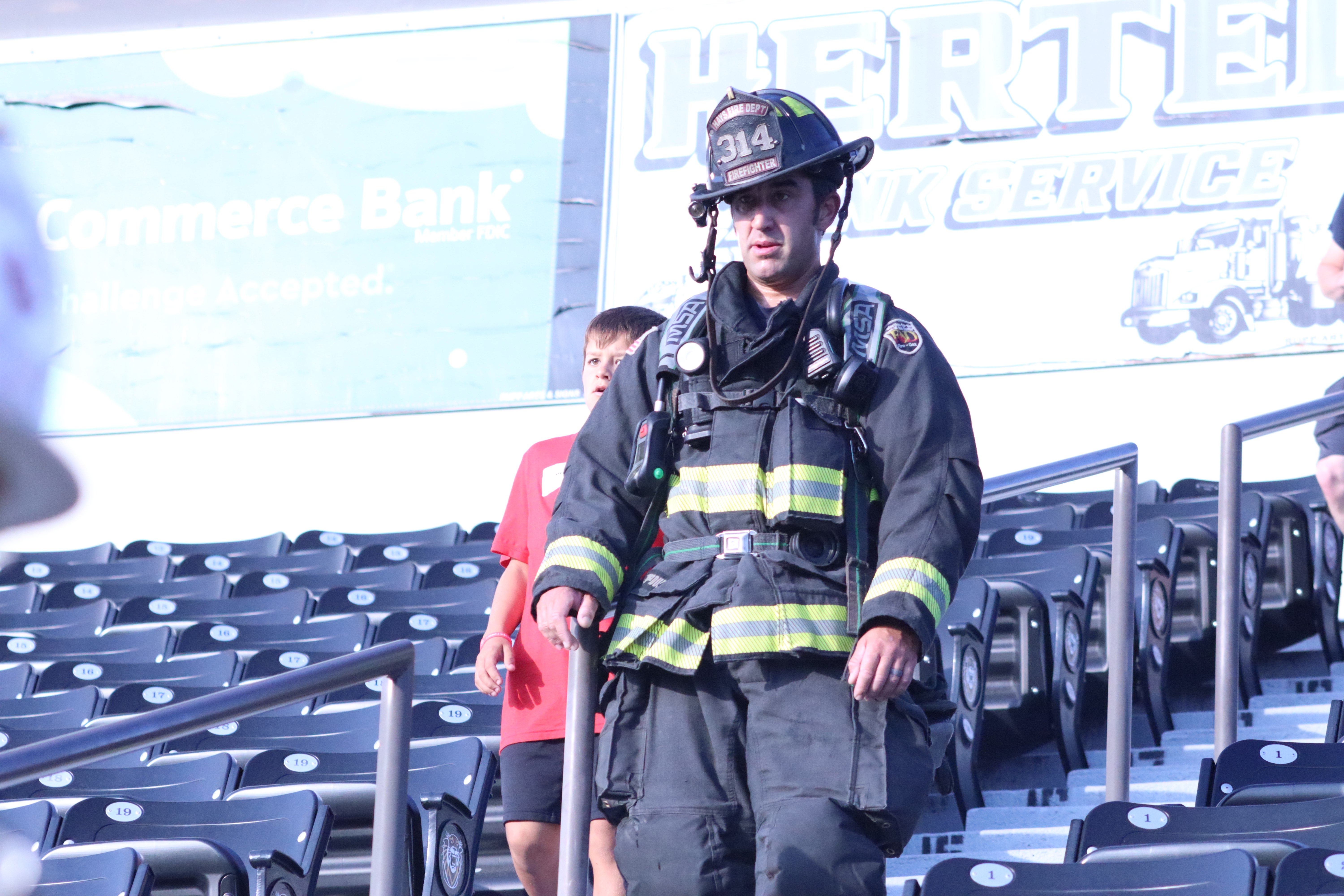 Hays firefighter Brandon Woods walks the stair climb in full gear.&nbsp;