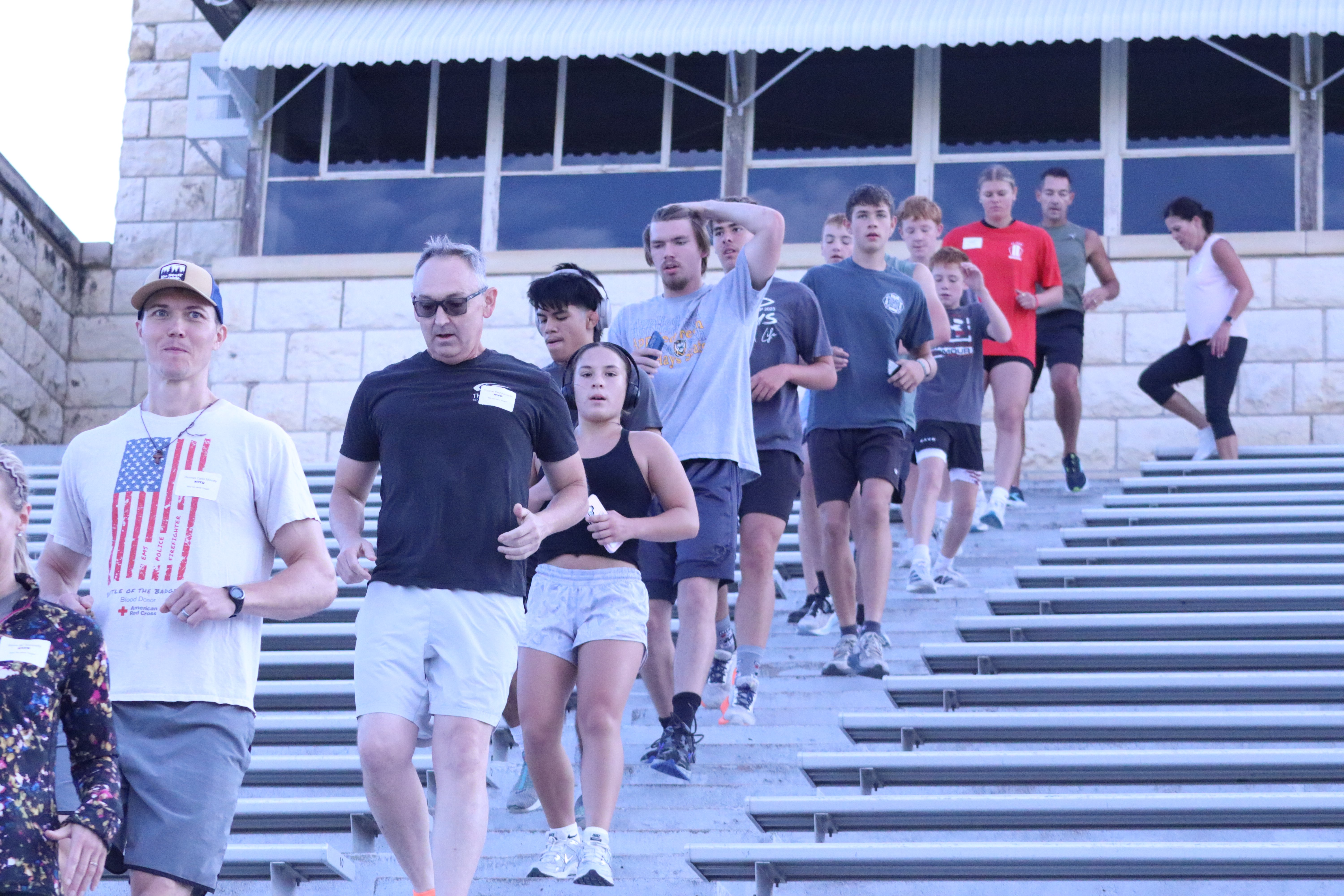 Participants make their way down the stairs at Lewis Field Stadium during the annual 9/11 Memorial Stair Climb.&nbsp;<br>