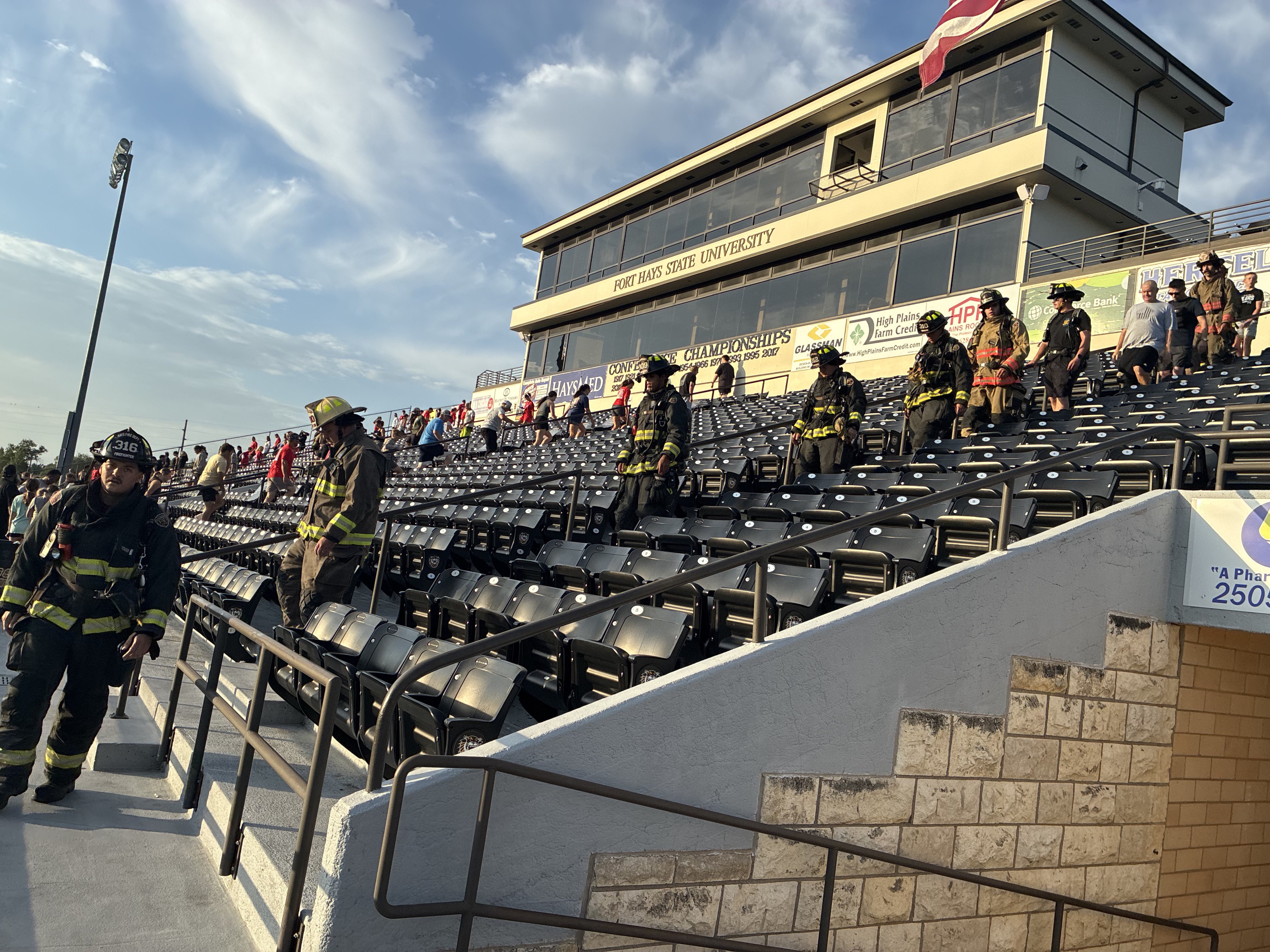 Firefighters walking down the stairs during the annual stair climb at Lewis Field.&nbsp;
