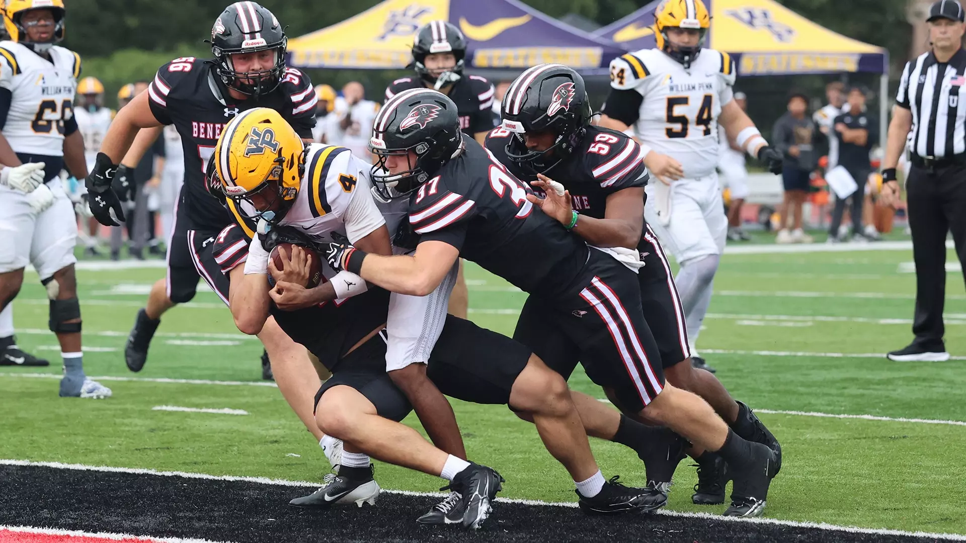 A herd of Ravens tackle William Penn wide receiver&nbsp;Branden Powell as No. 3 Benedictine won their home opener over the Statesmen 40-7/ Photo courtesy of Elida Murphy-Benedictine Athletics