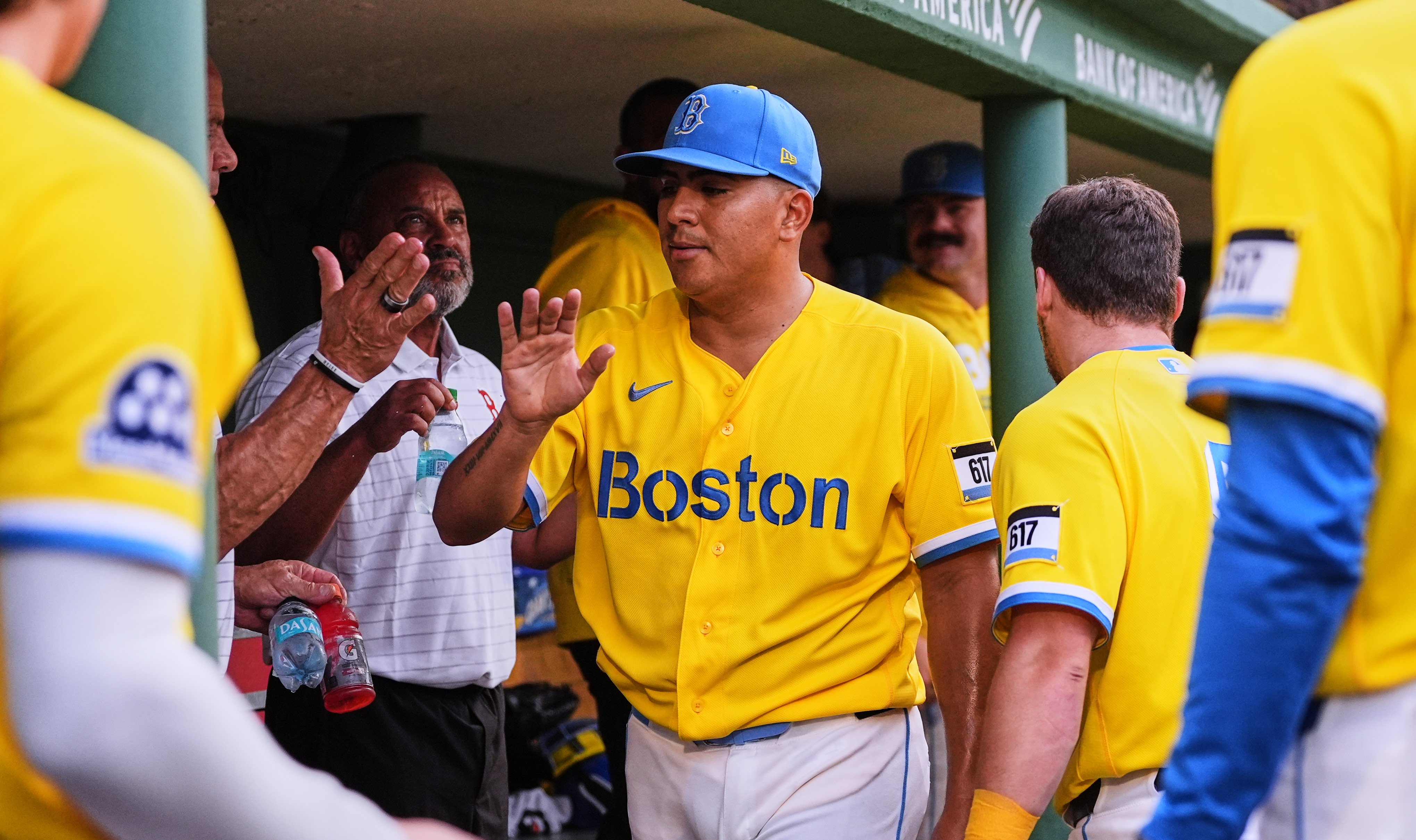 Boston Red Sox starting pitcher Ranger Suarez is congratulated by teammates following the top of the seventh inning of a baseball game after his outing against the Kansas City Royals, Saturday, Sept. 12, 2026, in Boston. (AP Photo/Charles Krupa)
