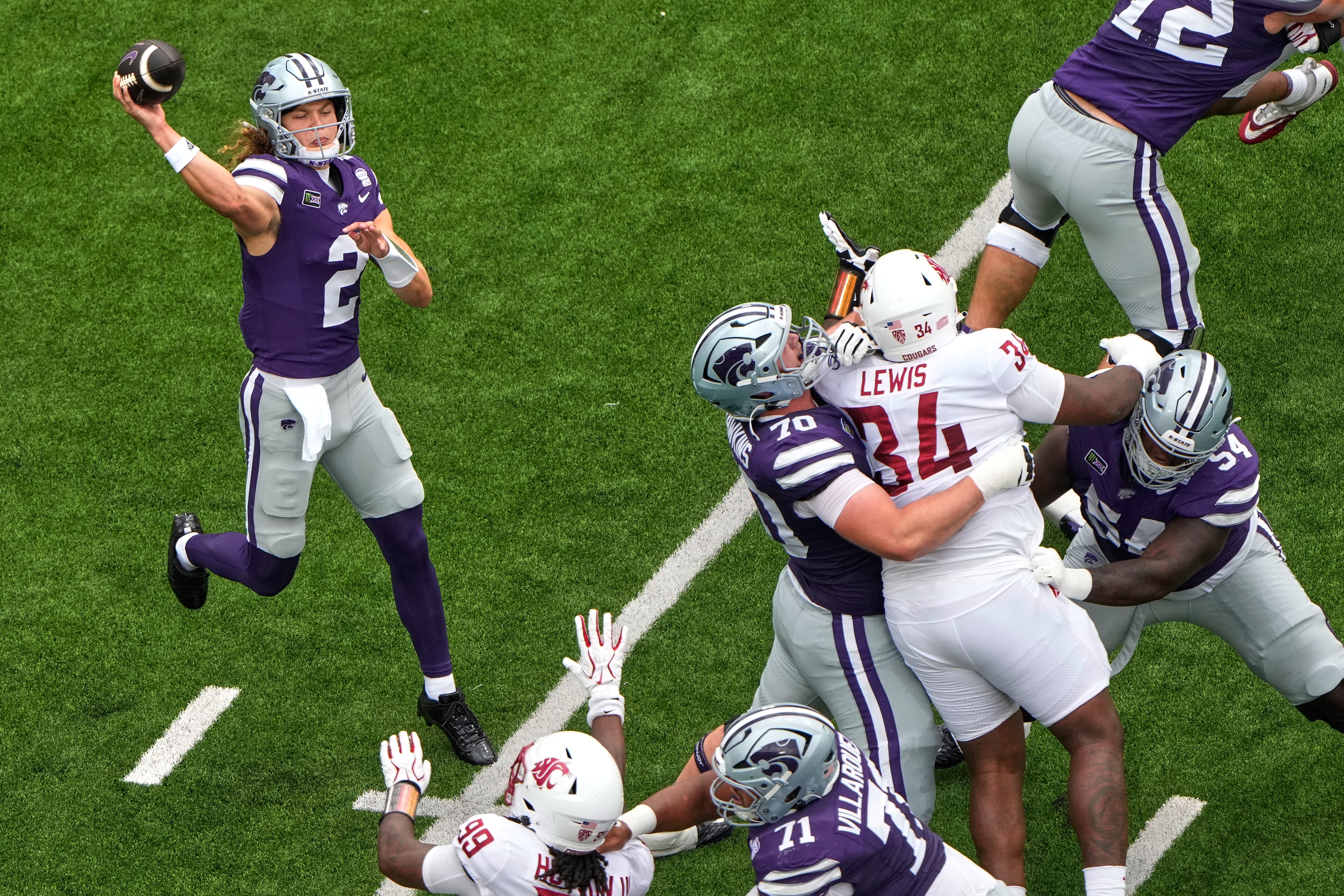 Kansas State quarterback Avery Johnson throws during the first half of an NCAA college football game against Washington State, Saturday, Sept. 12, 2026, in Manhattan, Kan. (AP Photo/Charlie Riedel)