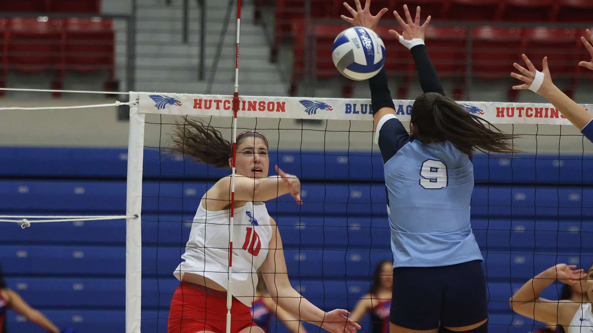 Julia Macedo goes down the line for one of her 13 kills in the Blue Dragons' five-set loss to No. 8 Colby on Monday night at the Sports Arena. (Billy Watson/Blue Dragon Sports Information).