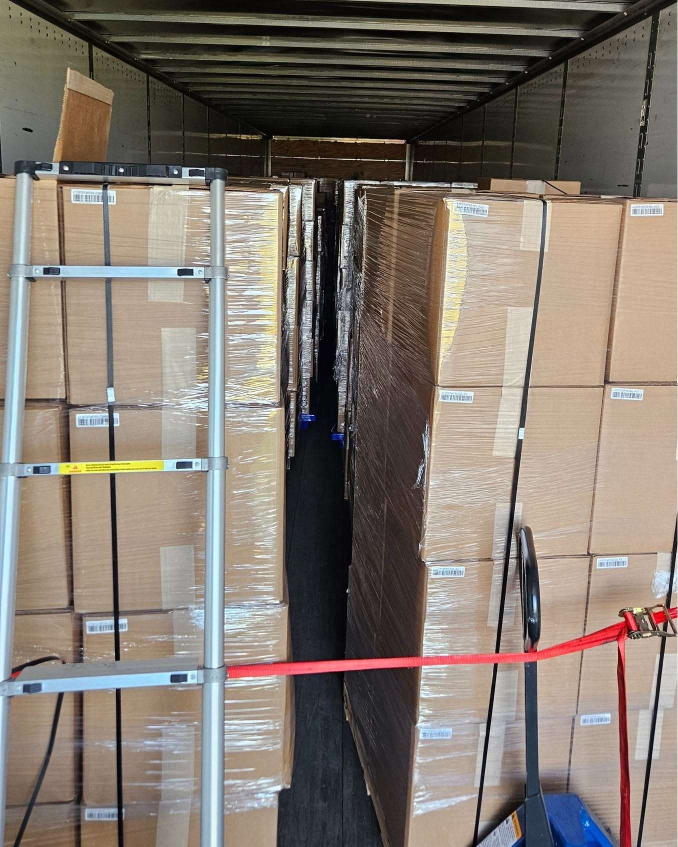 Boxes of Tannoy commercial speakers fill the interior of a semi-trailer during a Nebraska State Patrol investigation into stolen merchandise in Dawson County. (Courtesy NSP)