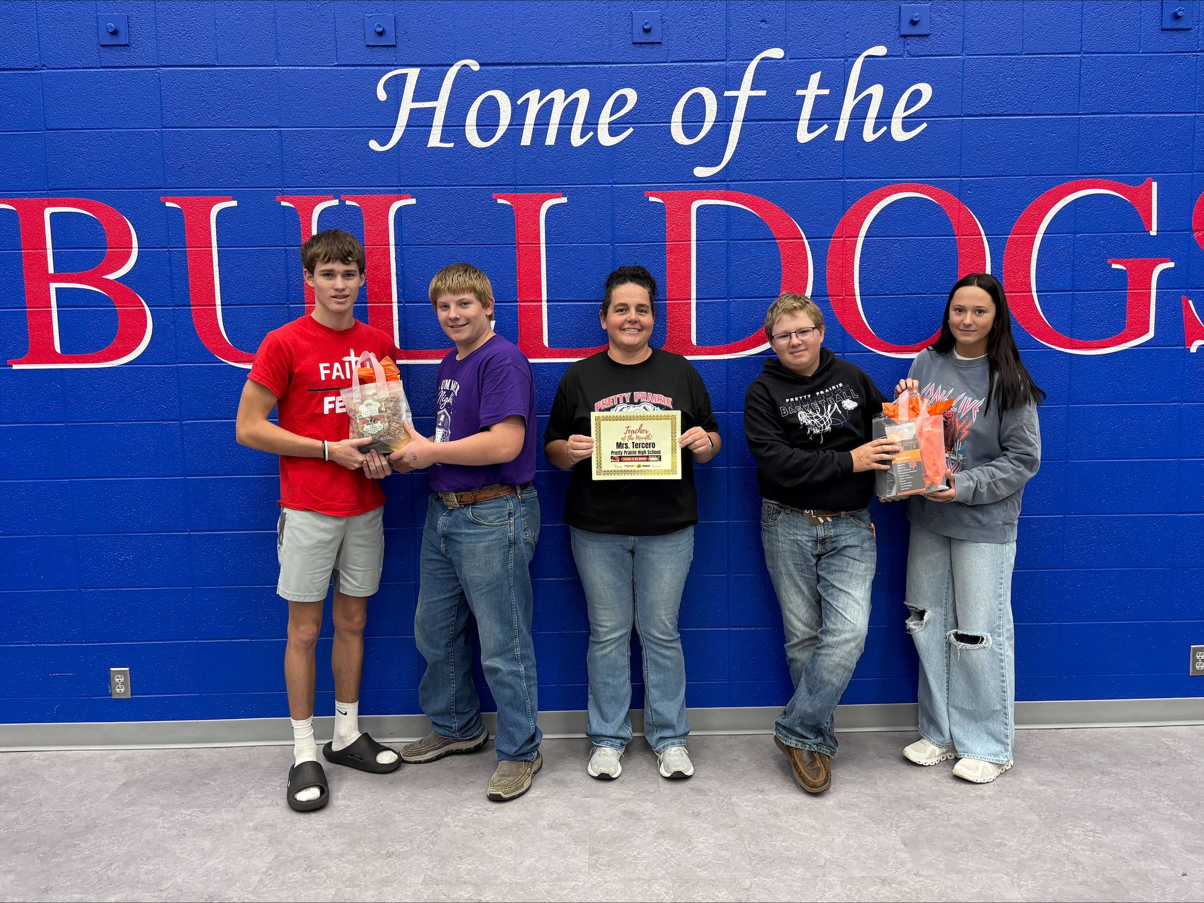 Pretty Prairie teacher Jessica Tercero, center, poses with students who nominated her for the September Teacher of the Month award, presented by Eagle Media and PrairieStar Health Center. Tercero was nominated by five students who praised her kindness, support and willingness to help. (Hutch Post photo)