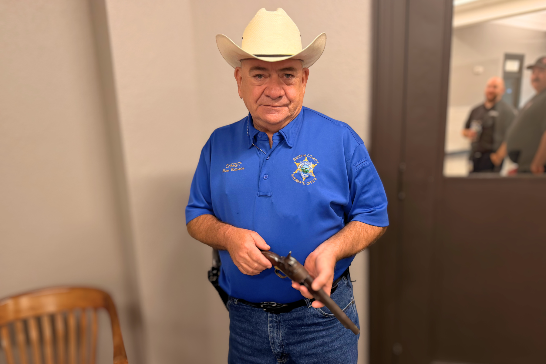 Barton County Sheriff Brian Bellendir holds the Colt Model 1860 Army percussion revolver once owned by George N. Moses, Barton County’s first Sheriff of record.