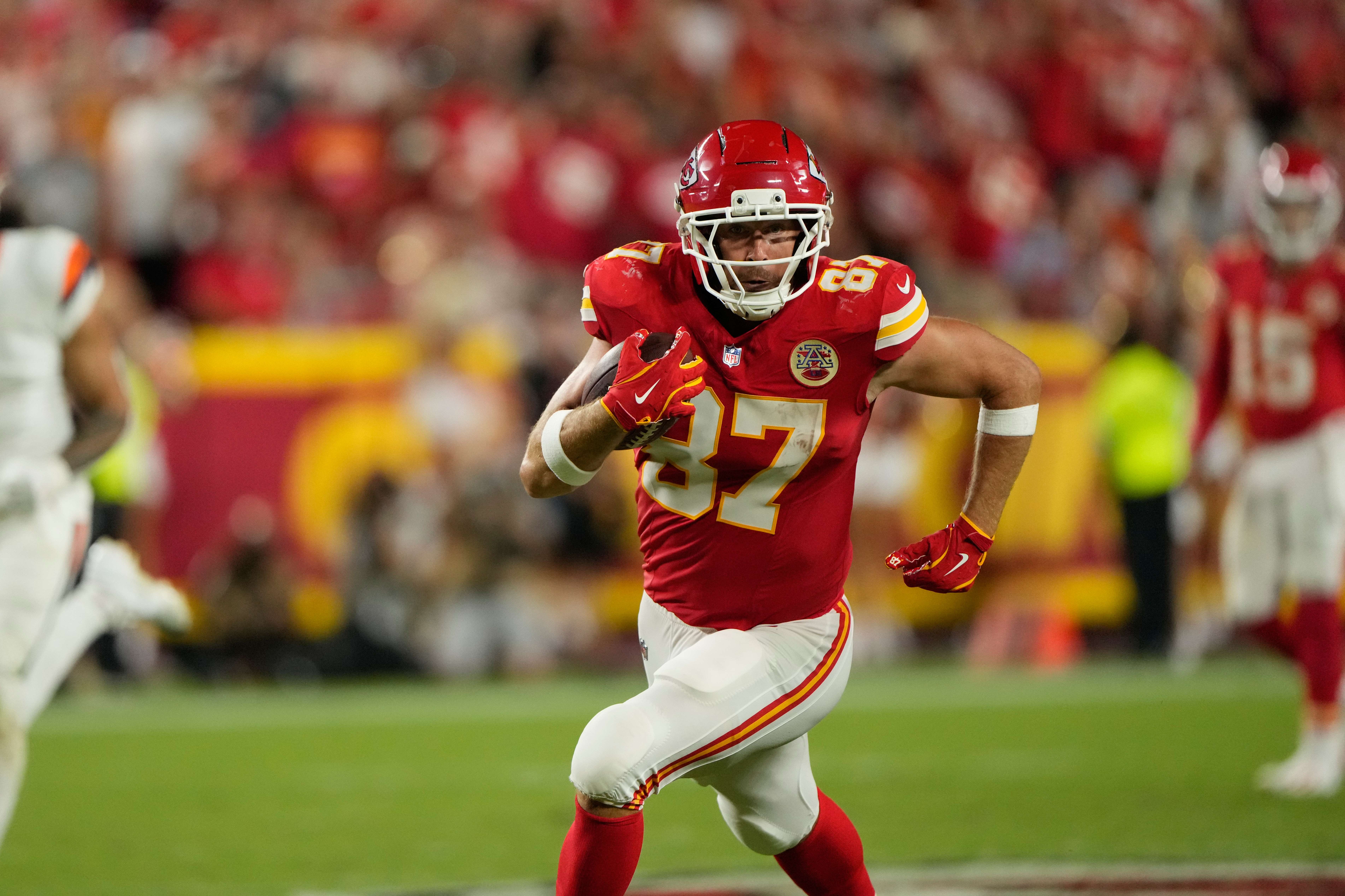 Kansas City Chiefs tight end Travis Kelce runs the ball after making a catch against the Denver Broncos during the second half of an NFL football game Monday, Sept. 14, 2026, in Kansas City, Mo. (AP Photo/Charlie Riedel)