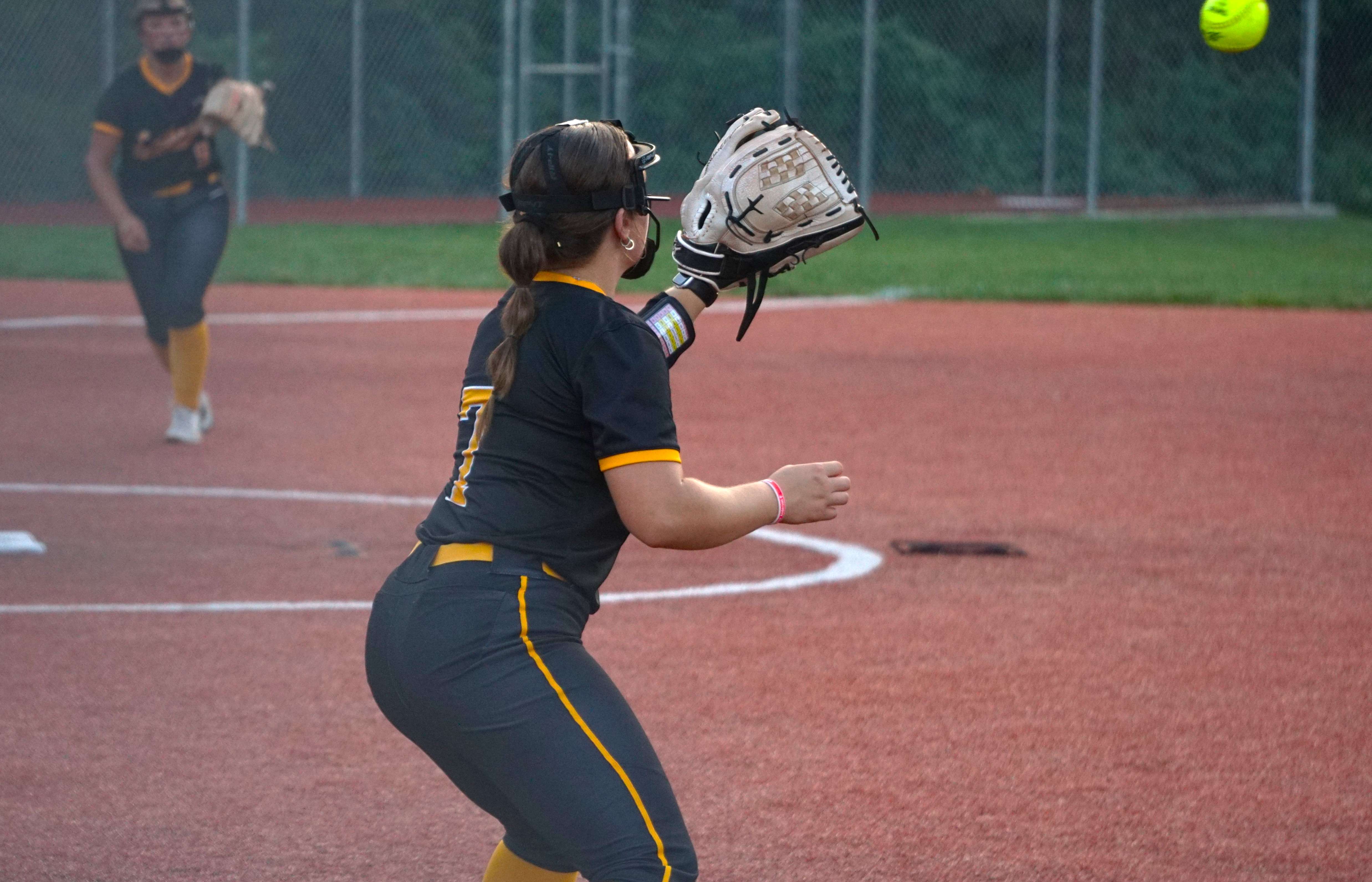 Lathrop's Jolene Ashcraft fields a ball thrown to first base/ Photo by Matt Pike