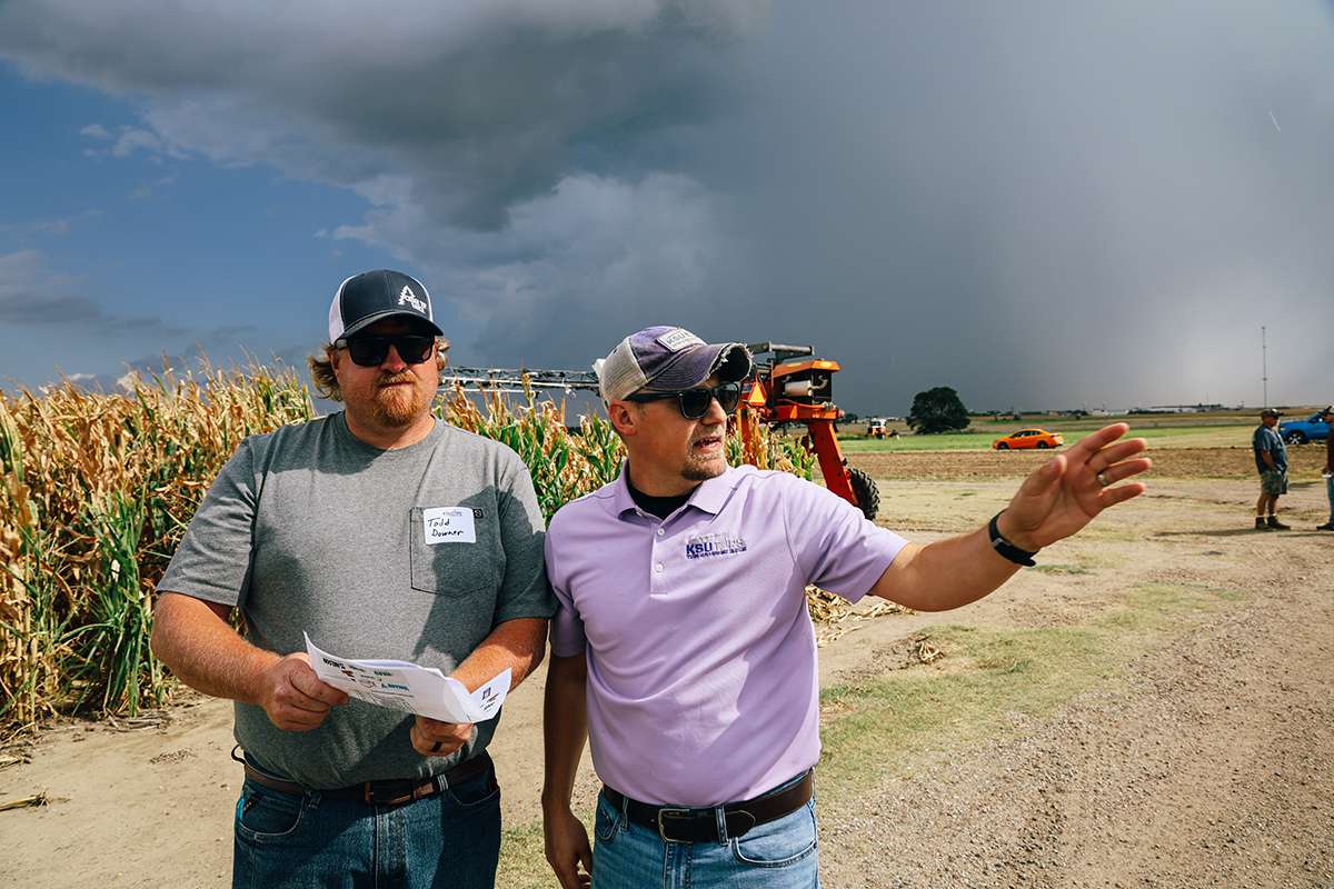 Daran Rudnick with TAPS at K-State visits with a competitor at the Field Experience in Colby. Photo courtesy K-State Research and Extension