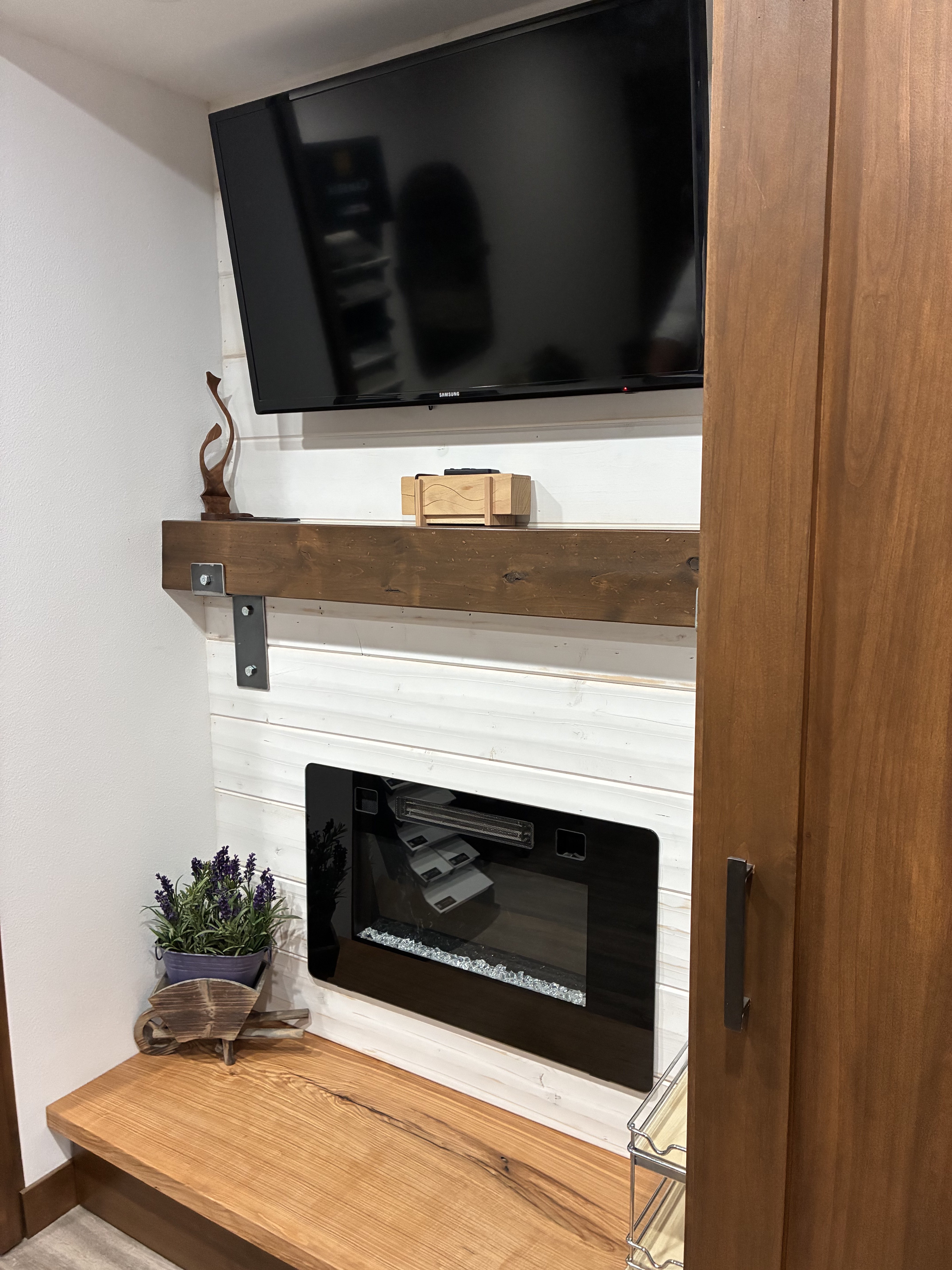 A finished fireplace display at Hays Planing Mill showcases the woodwork, hardware, mantel, and other elements used in a custom design.<br>