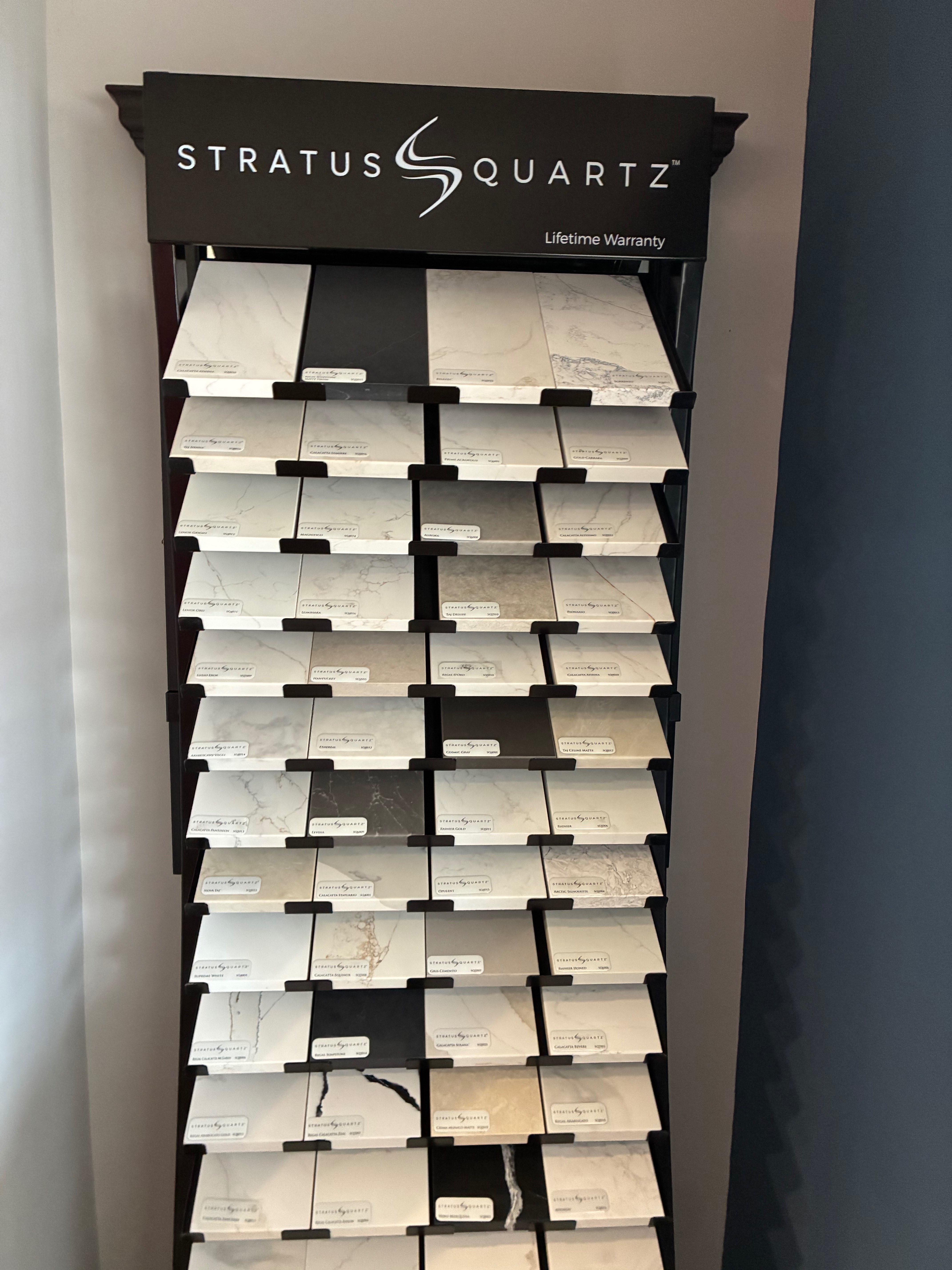 A display at Hays Planing Mill features quartz samples in a variety of colors and patterns.<br>