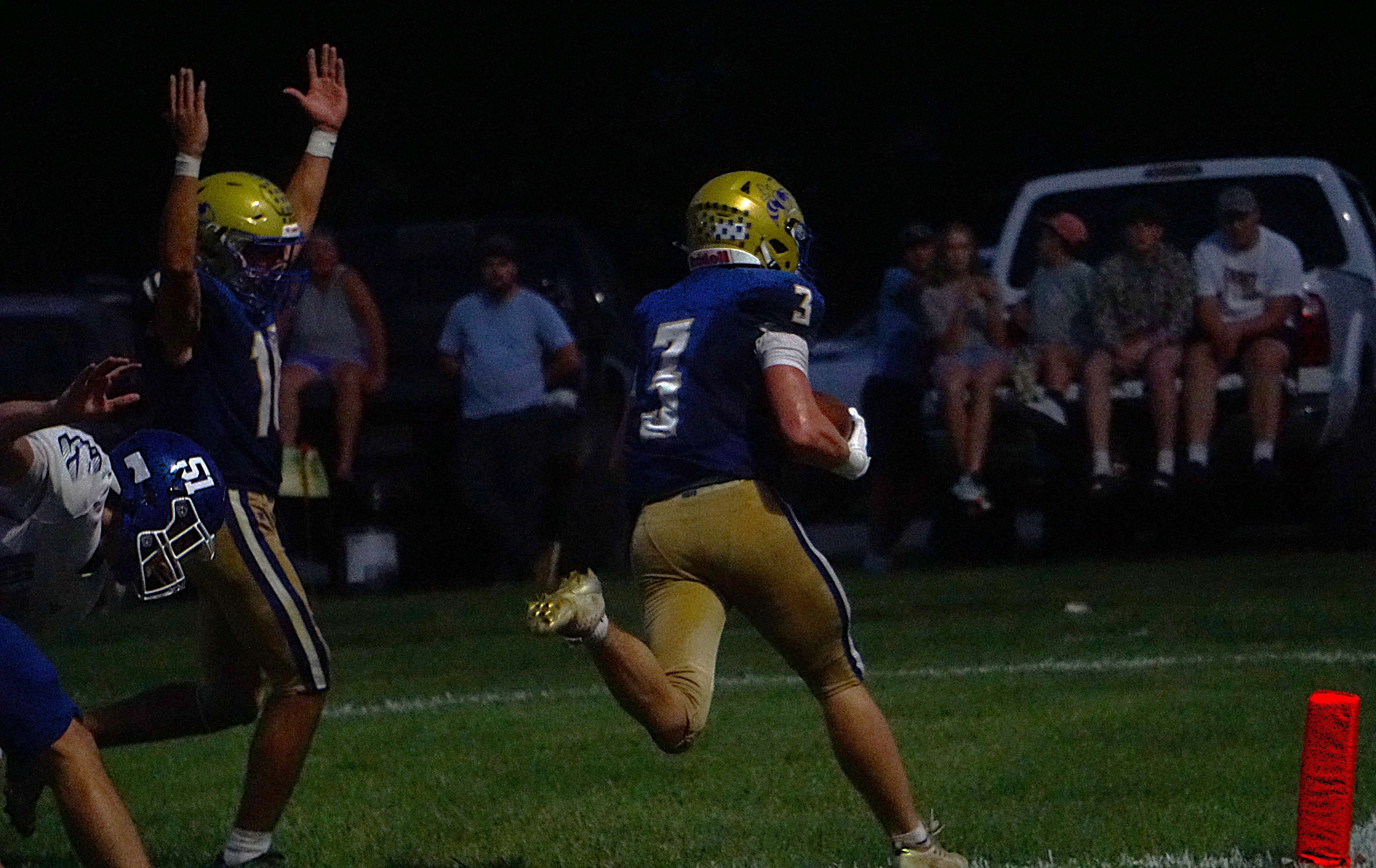 Penney's Aidan Hawkins (3) runs in for a two point conversion/ Photo by Matt Pike