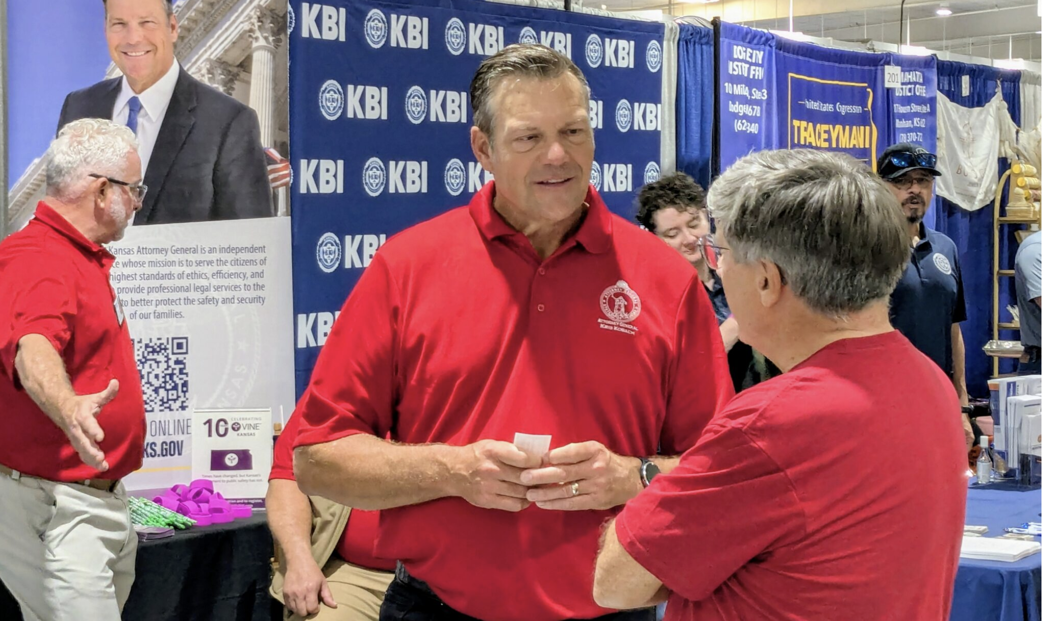 Kansas Attorney General Kris Kobach, interacting with voters Saturday at the Kansas State Fair in Hutchinson, says he doesn’t plan to seek the endorsement of President Donald Trump in his reelection campaign against Democratic nominee Chris Mann. (Photo by Tim Carpenter/Kansas Reflector)