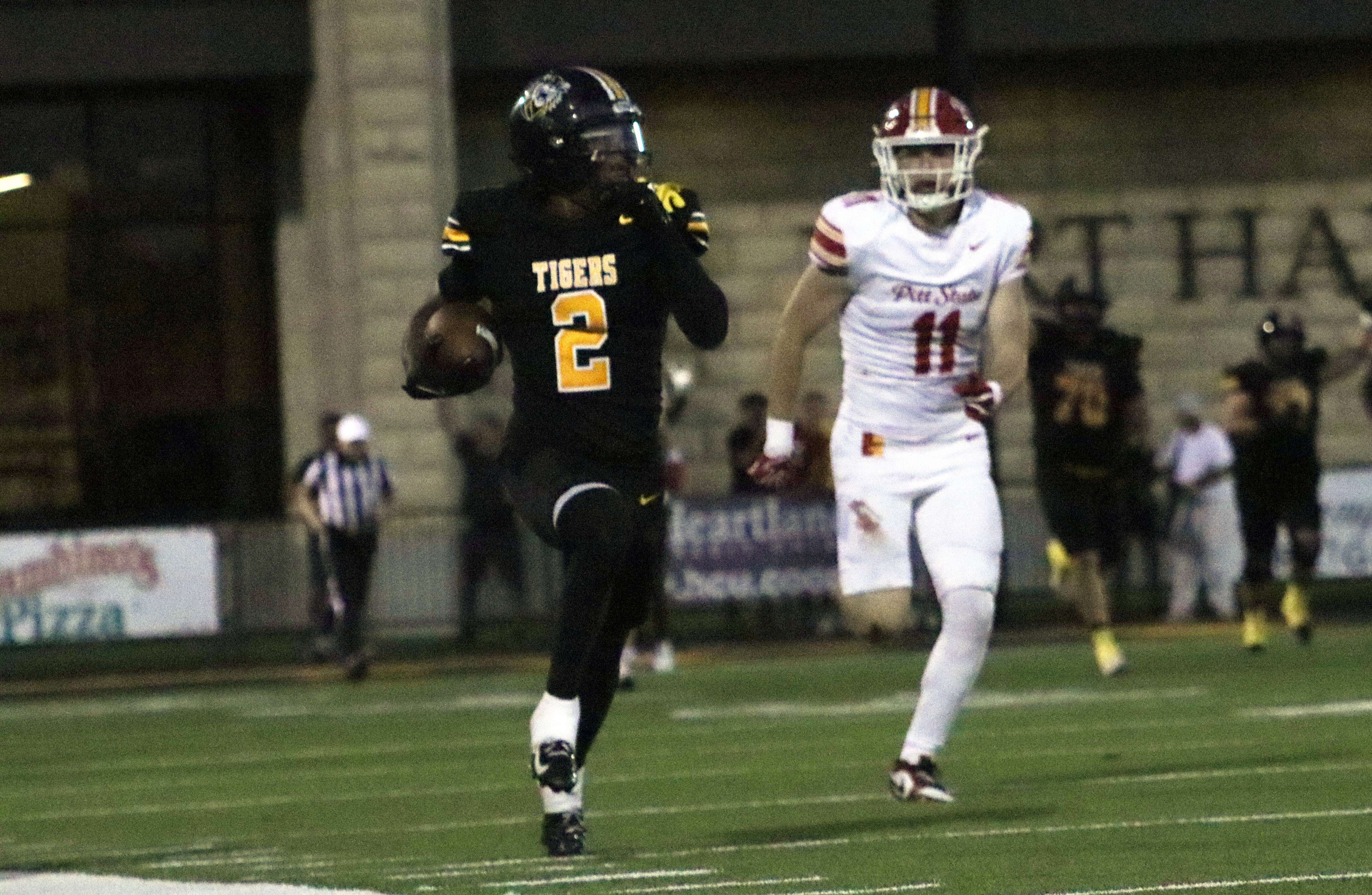 Fort Hays State wide receiver Ayden Robinson-Wayne (11) races down the sideline past Pittsburg State's Mario Menghini (11) during a school record 97-yard touchdown catch from quarterback Major Cantrell in the first half of an MIAA football game on Saturday, September 19, 2026 in Hays, Kan. (Hays Post photo/Alin Hett)