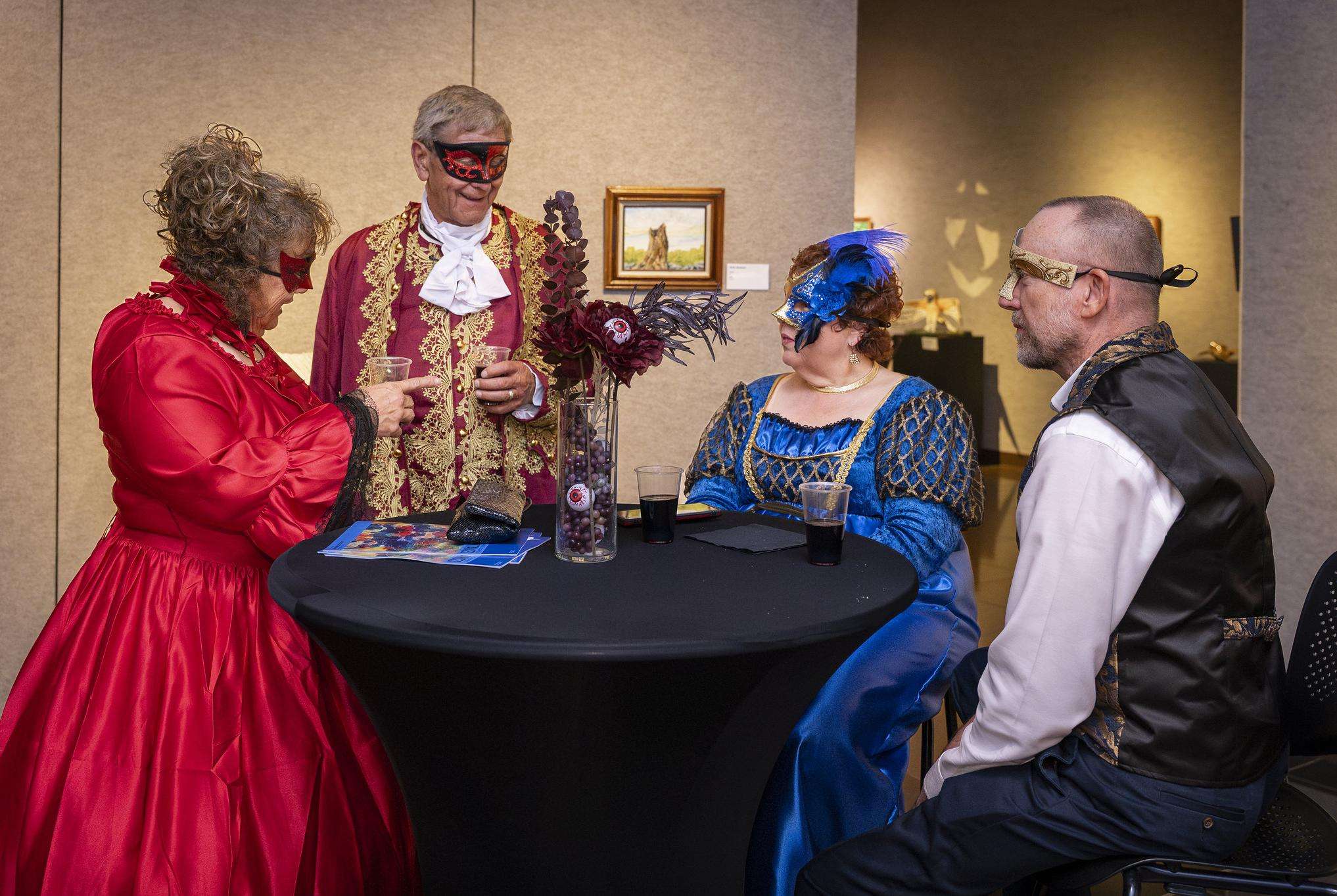 Attendees from last year's Bill McKown Masquerade Ball enjoy the festivities in the Shafer Art Gallery. (photo by Aaron Weber)