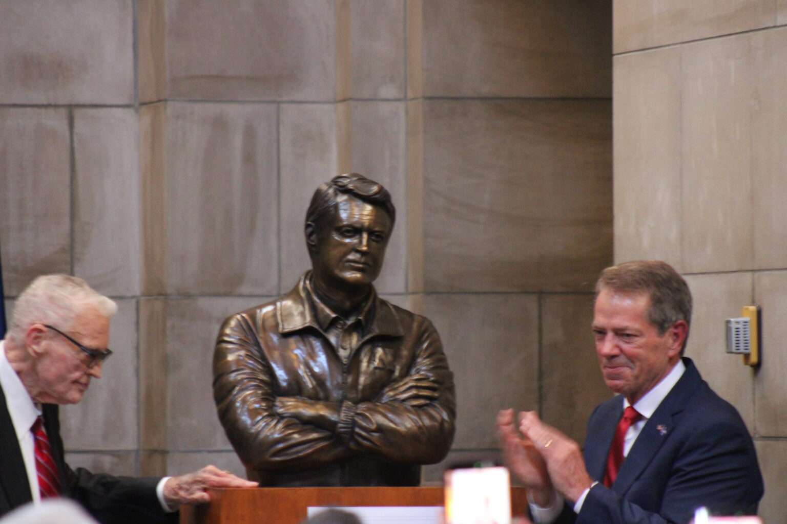 The statue of former Husker football coach Tom Osborne is unveiled in the Nebraska State Capitol Rotunda on Sept. 18, 2026. (Juan Salinas II/Nebraska Examiner)