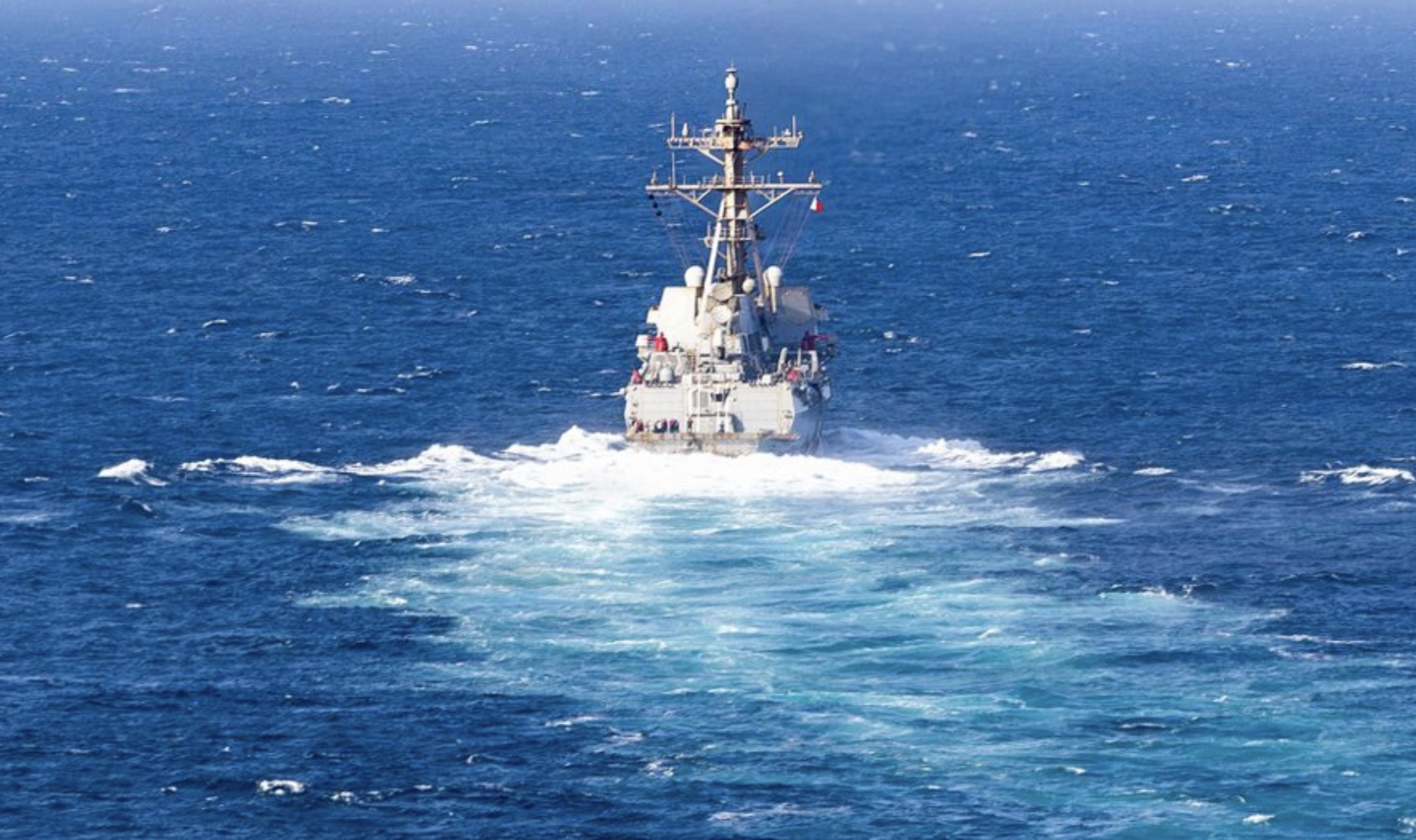 USS Rafael Peralta (DDG 115) sails in regional waters as the guided-missile destroyer continues strict enforcement of the U.S. blockade against Iran, preventing commerce from entering or departing Iranian ports and coastal areas. As of Sept. 21, U.S. forces have redirected 110 commercial vessels to ensure compliance.