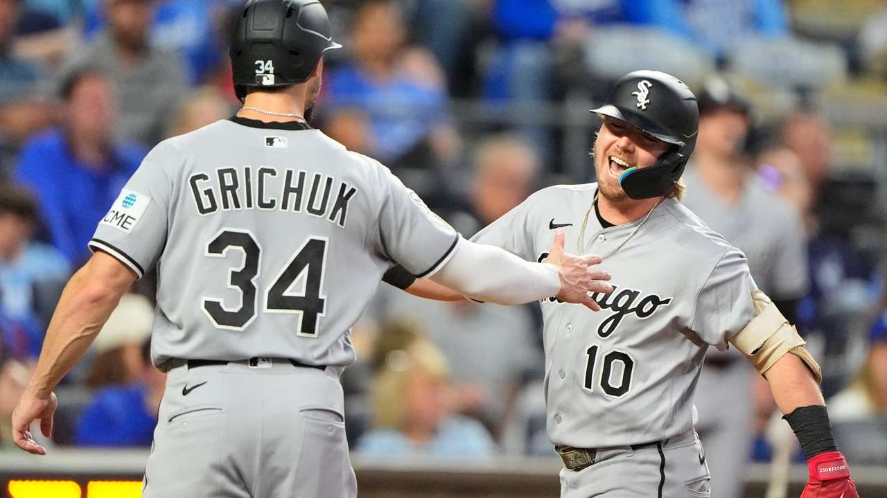 Chicago White Sox's Chase Meidroth (10) celebrates with Randal Grichuk after hitting a three-run home run during the third inning of a baseball game against the Kansas City Royals, Tuesday, Sept. 22, 2026, in Kansas City, Mo. (AP Photo/Charlie Riedel)