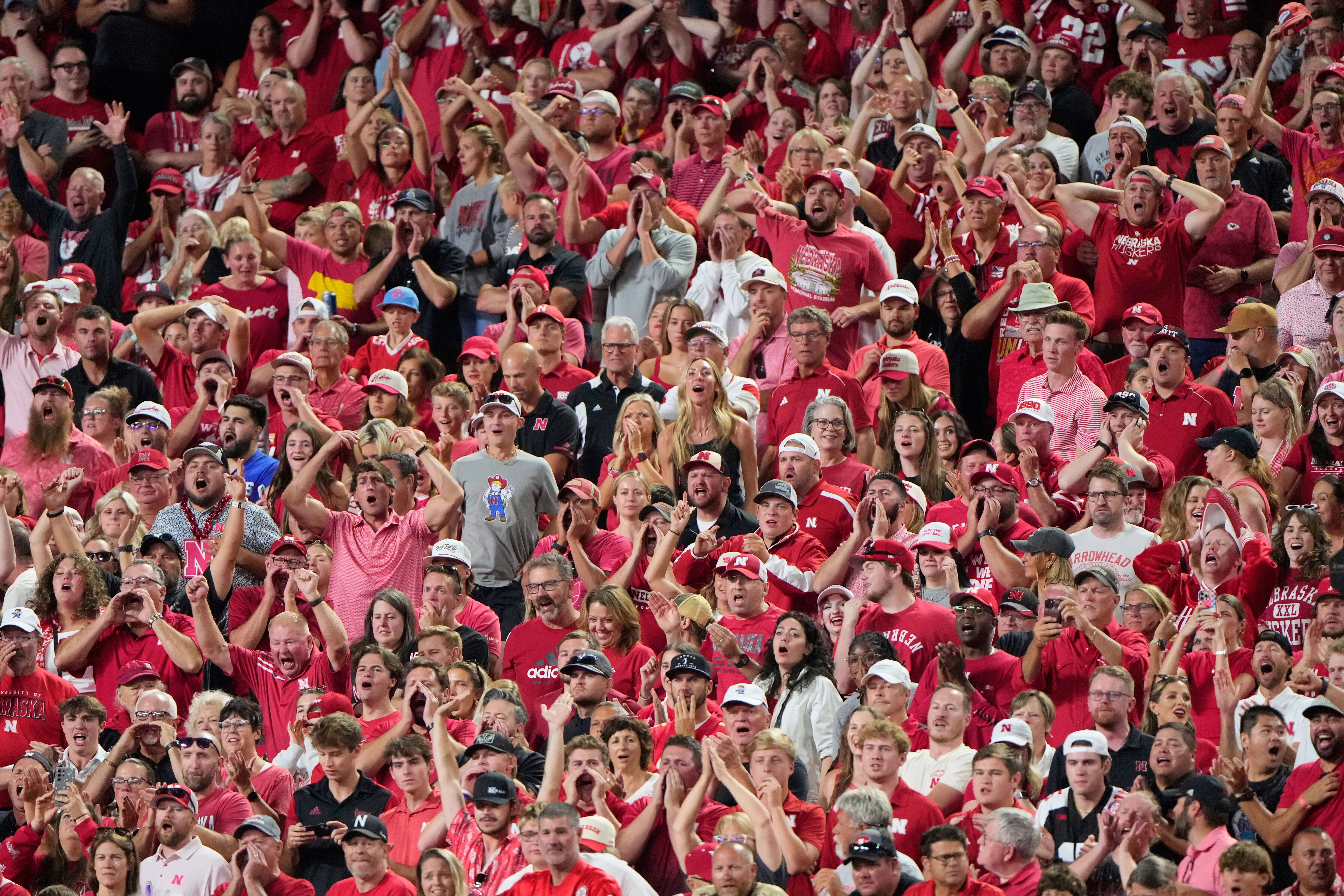 Fans cheer during the second half of an NCAA college football game between Cincinnati and Nebraska, Aug. 28, 2025, at Arrowhead Stadium in Kansas City, Mo. (AP Photo/Charlie Riedel, File)