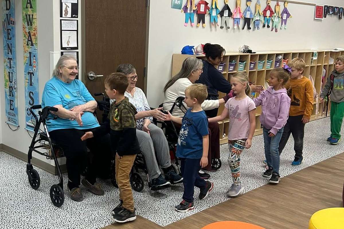 Every Friday, students at the Logan LIFE Center start off their school day by walking down the hallway and high-fiving their friends at the Logan Manor nursing home.