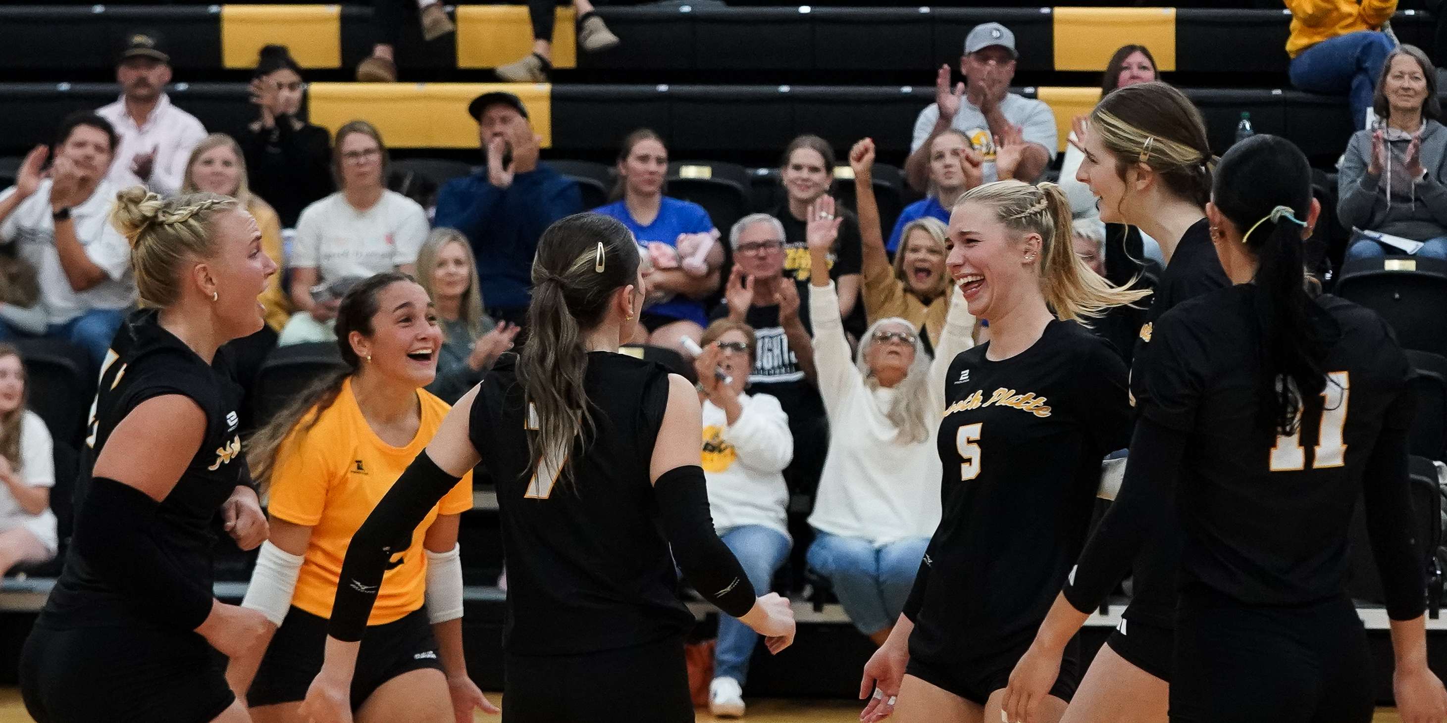 The volleyball team celebrates after winning the second set against McCook Community College on Tuesday. (Skylar Evans, North Platte Community College)