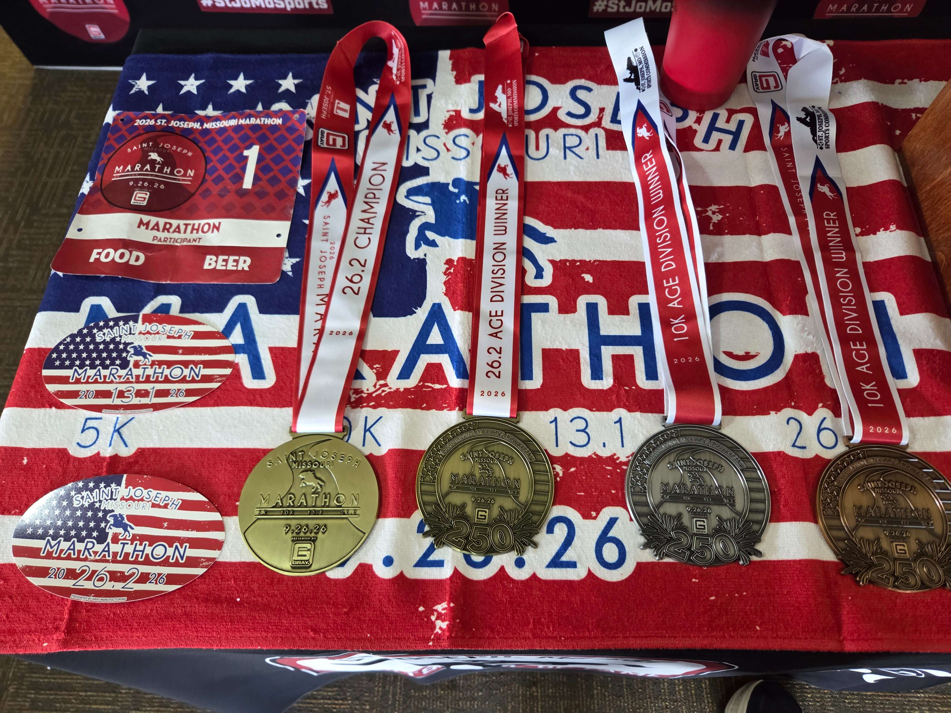Prize medals that will be awarded during the fourth annual St. Joseph Marathon on Saturday along with other race swag that will be given away/ Photo by Matt Pike