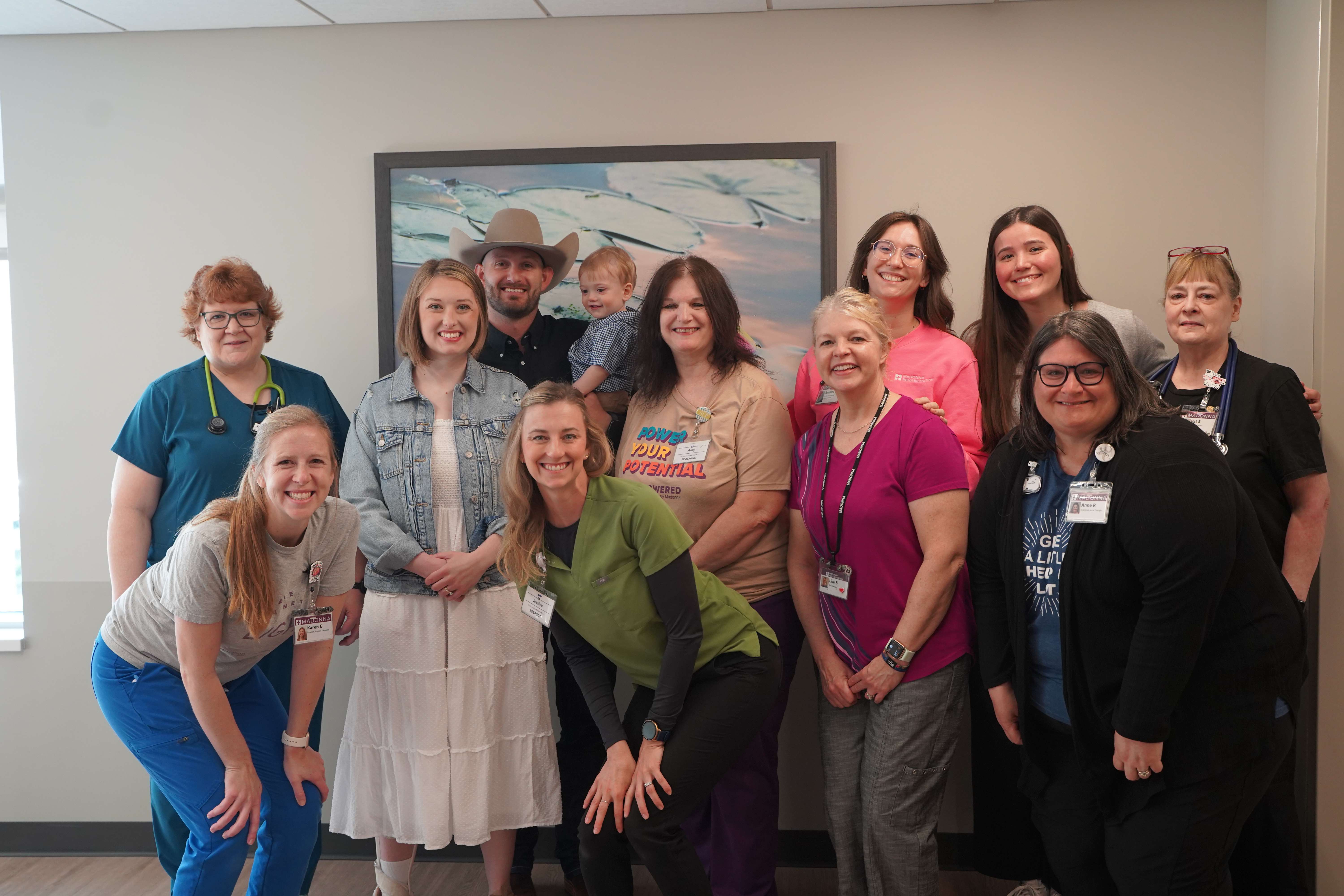 Jenna Daily (in white dress) suffered an aneurysm and stroke on March 31, 2025. Pictured with her husband, Cayden, and child, Rai, Jenna's accomplishments in therapy were recently highlighted by Madonna Rehabilitation Hospitals in Lincoln, Neb. (all photos courtesy of Madonna Rehabilitation Hospitals) 