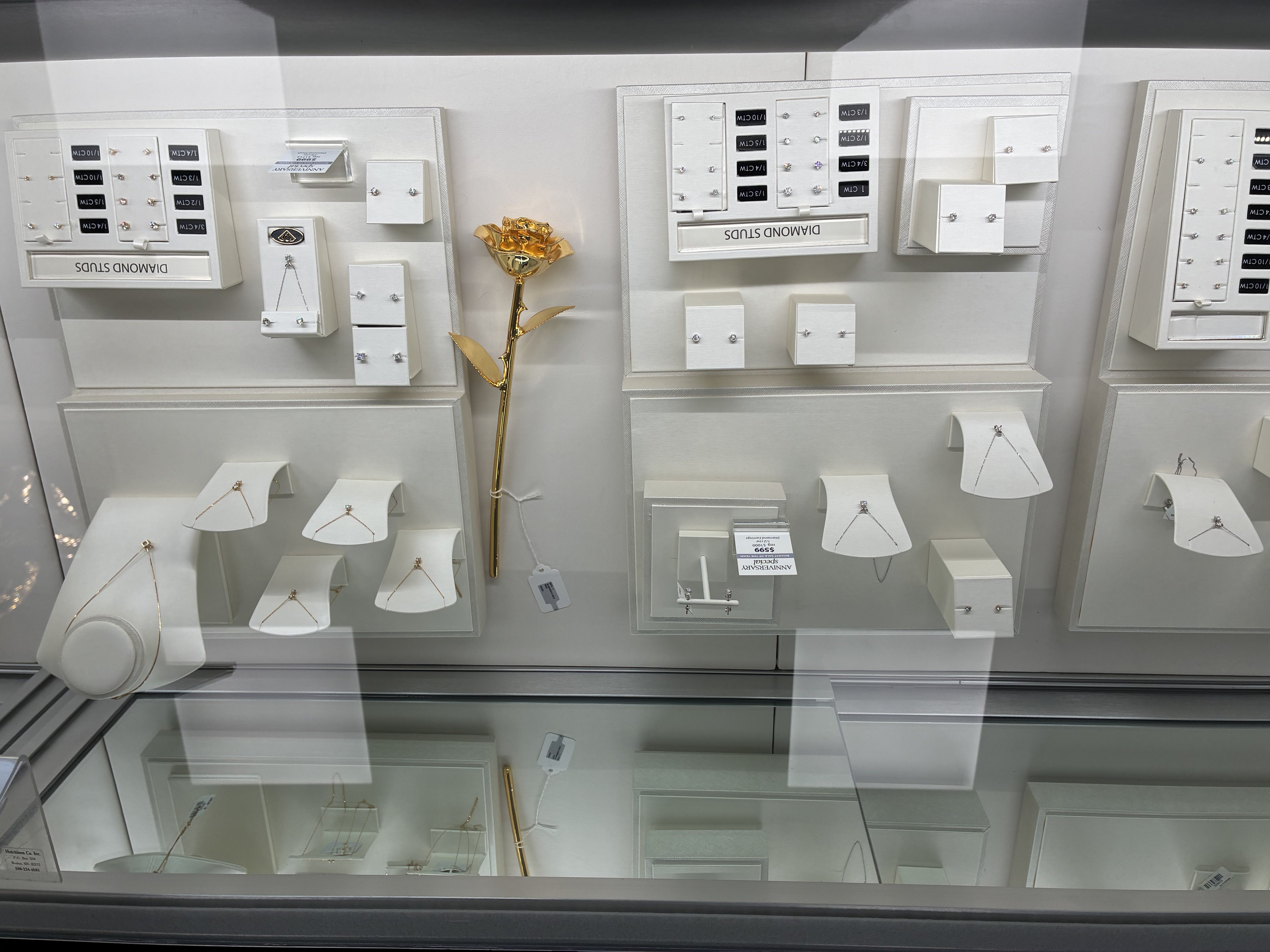 Diamond studs, necklaces and a gold rose are displayed in a case at the jewelry store’s new location in Hays. Photo by Alin Hett/Hays Post