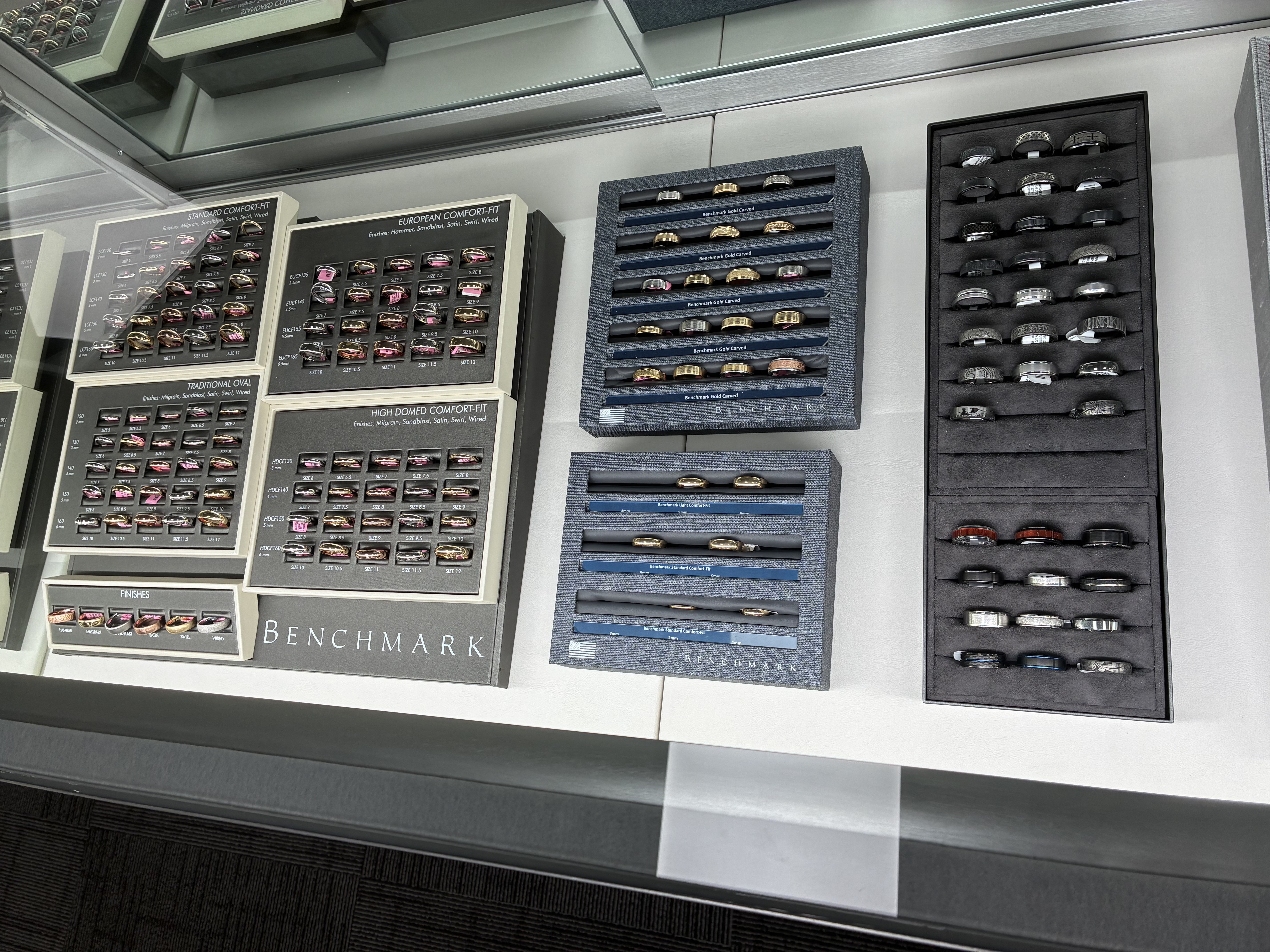 Wedding bands in a range of styles and finishes are displayed at the jewelry store’s new Hays location. Photo by Alin Hett/Hays Post<br>