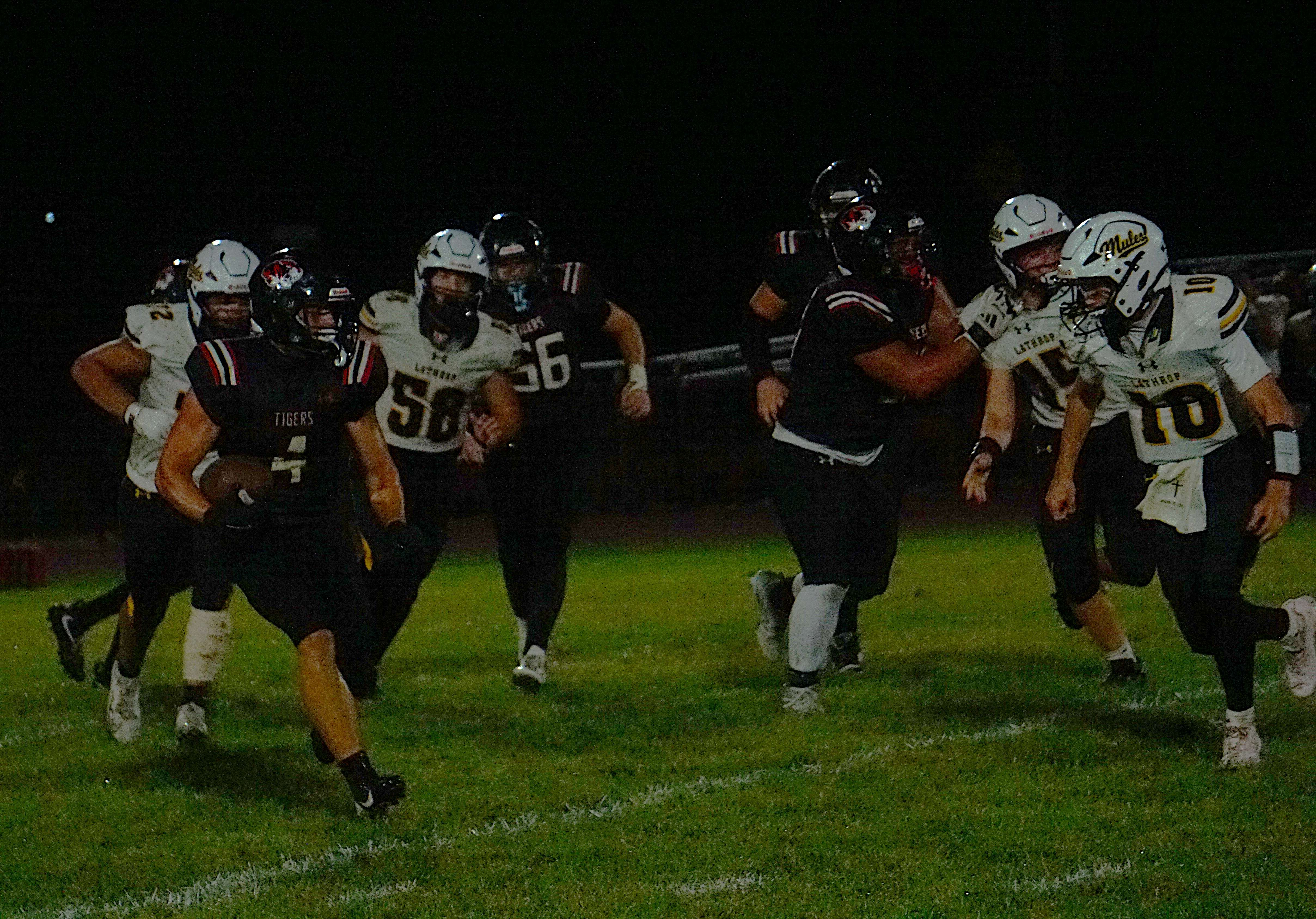 Brycen McClelland breaks a run against Lathrop/ Photo by Matt Pike