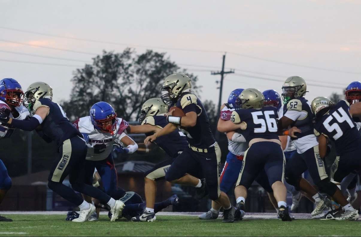 Maddox Wells rushes for a first down against Republic County. Photo by Kaiden Comeau.