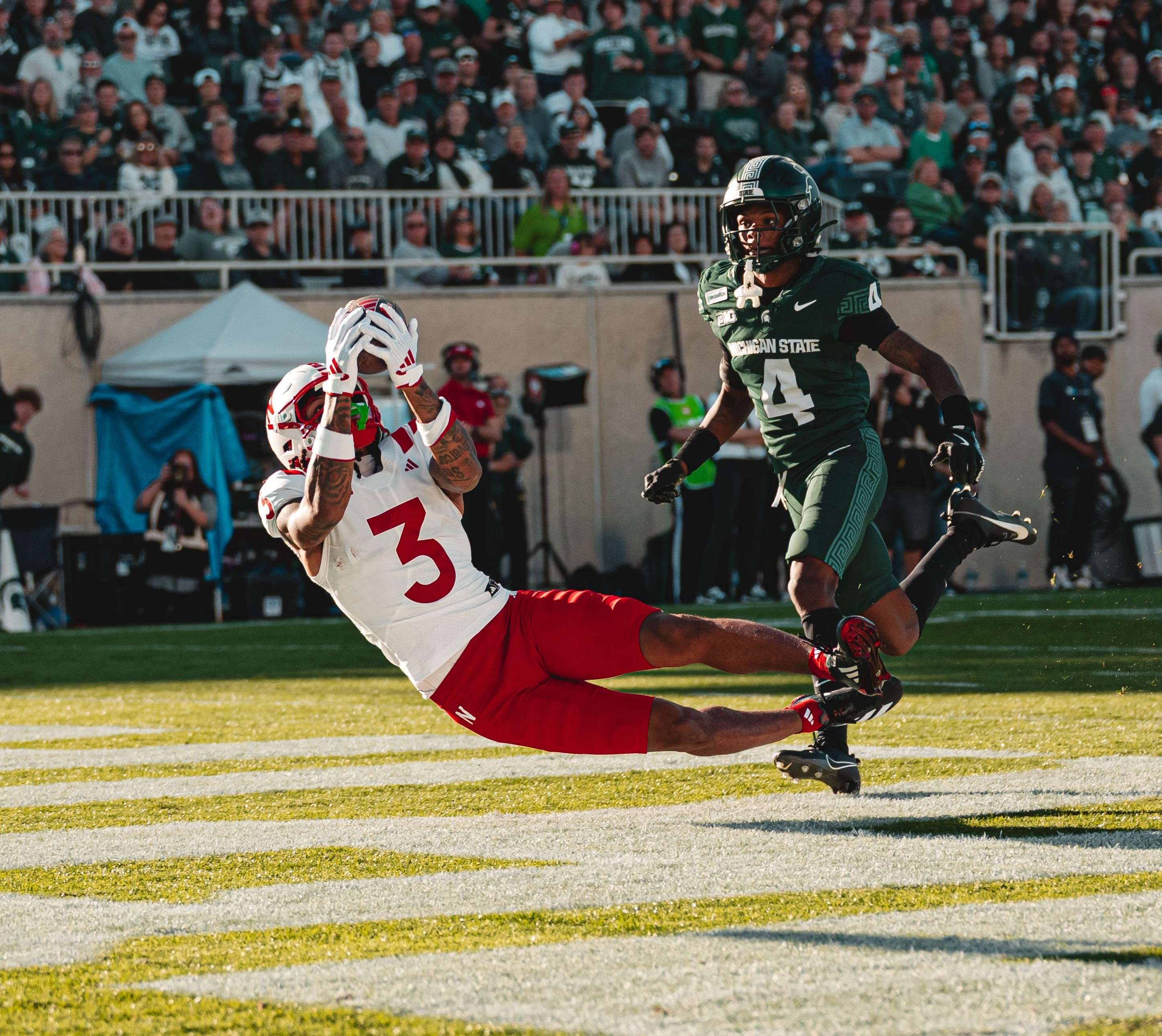 Kwazi Gilmer (3) makes a diving catch in the endzone. Gilmer had four catches for 101 yards and a touchdown as Nebraska beat Michigan State 31-13/ Photo courtesy of Nebraska Football