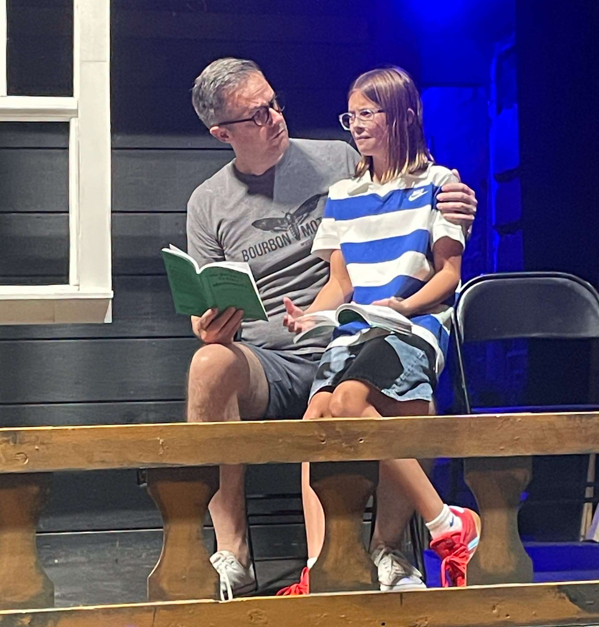 Atticus (Danny Nowlan) and Scout (Elise Henry) on the porch of the Finch home. (Photo courtesy Family Community Theatre)