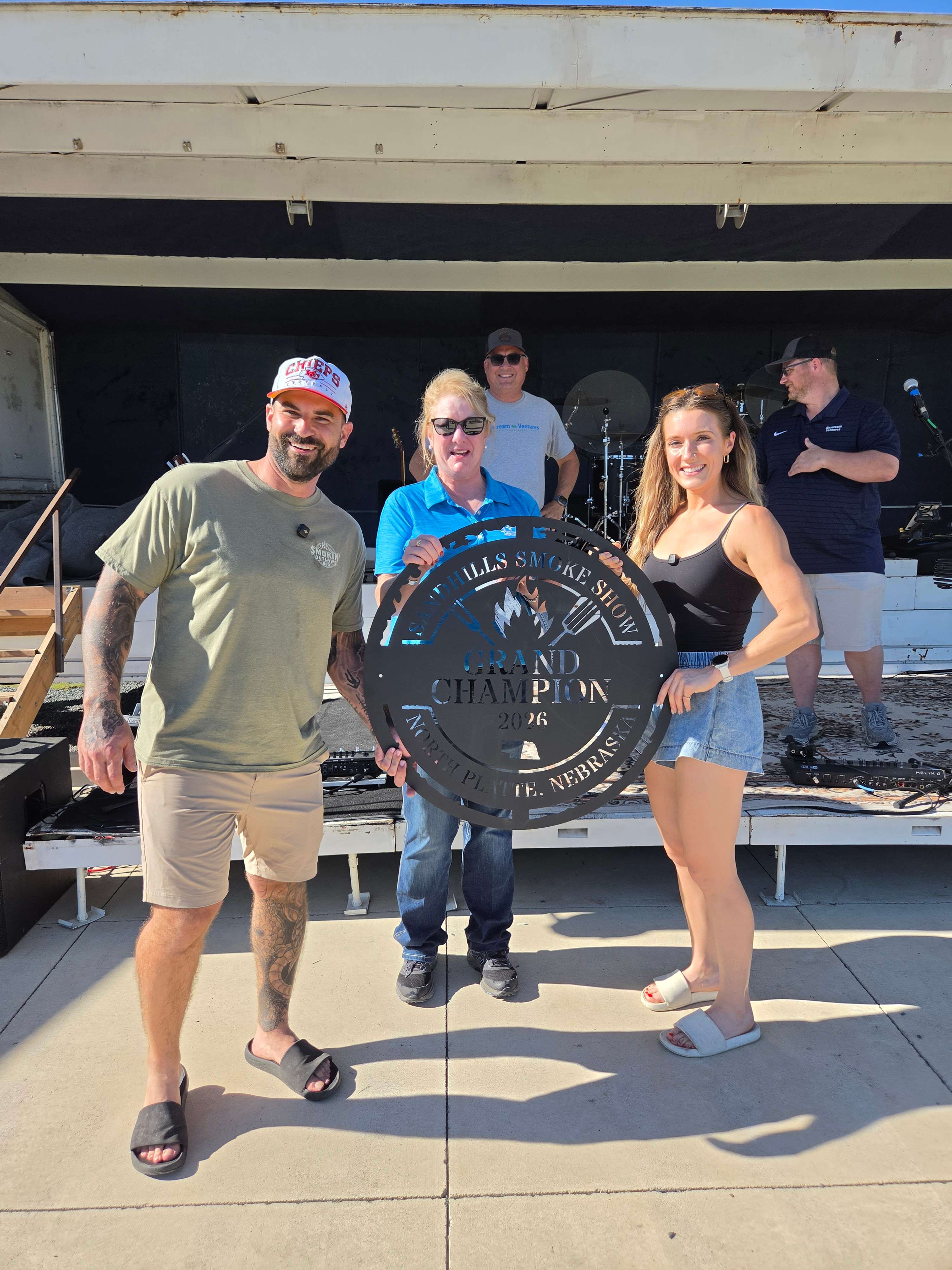 Smokin Outlaws celebrates its Grand Championship victory at the inaugural Sandhills Smoke Show BBQ on Saturday, September 26, at Pals Brewing Company in North Platte. The team claimed the overall title with a score of 704.5484, along with first-place finishes in brisket and Friday night's One Meat Rib Contest. (Courtesy Image)