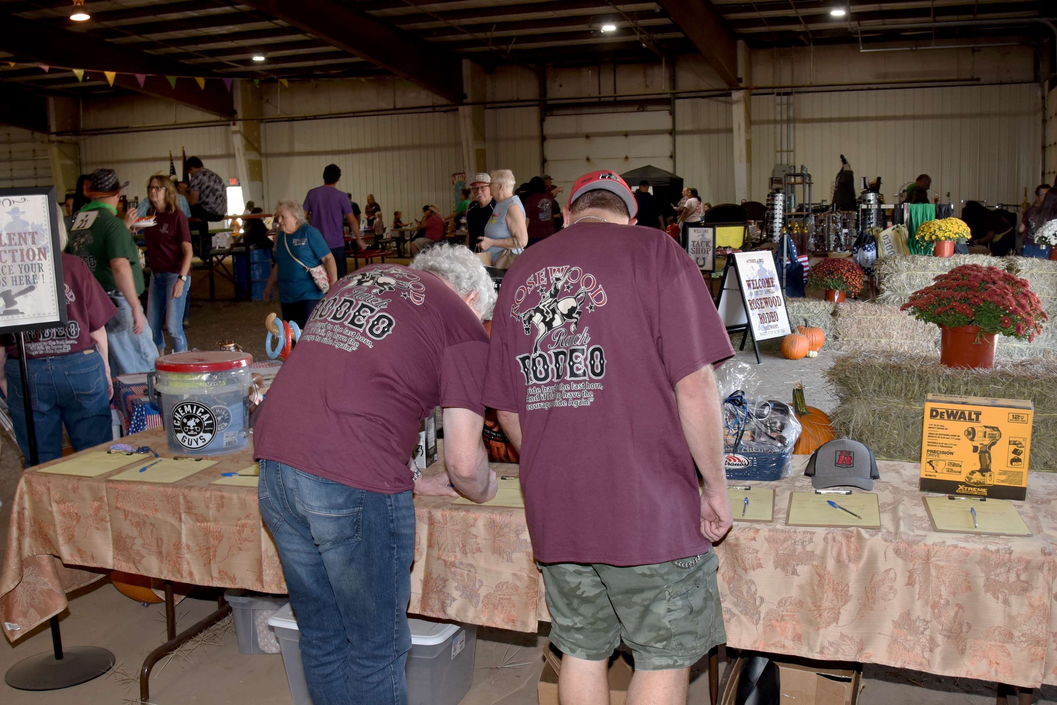 Attendees check on the many selections of quality silent auction items during last year’s Rosewood Rodeo. There are more than 70 auction items to bid on at this year’s rodeo. The silent auction annually provides a fun opportunity to purchase quality items at under-market value. Proceeds from the sale of the items, which are donated by community businesses, go directly to Rosewood Roots and Wings Foundation, committed to helping to fund endeavors for people with developmental disabilities.
